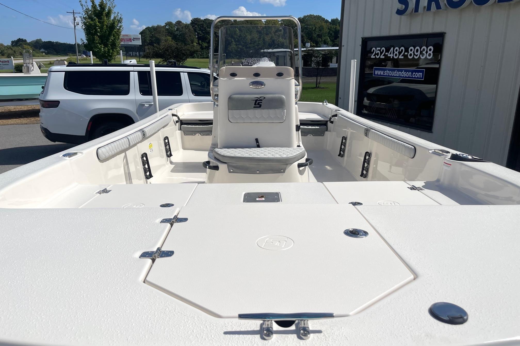 2026 Carolina Skiff 19 LS boat interior with seating and storage compartments.