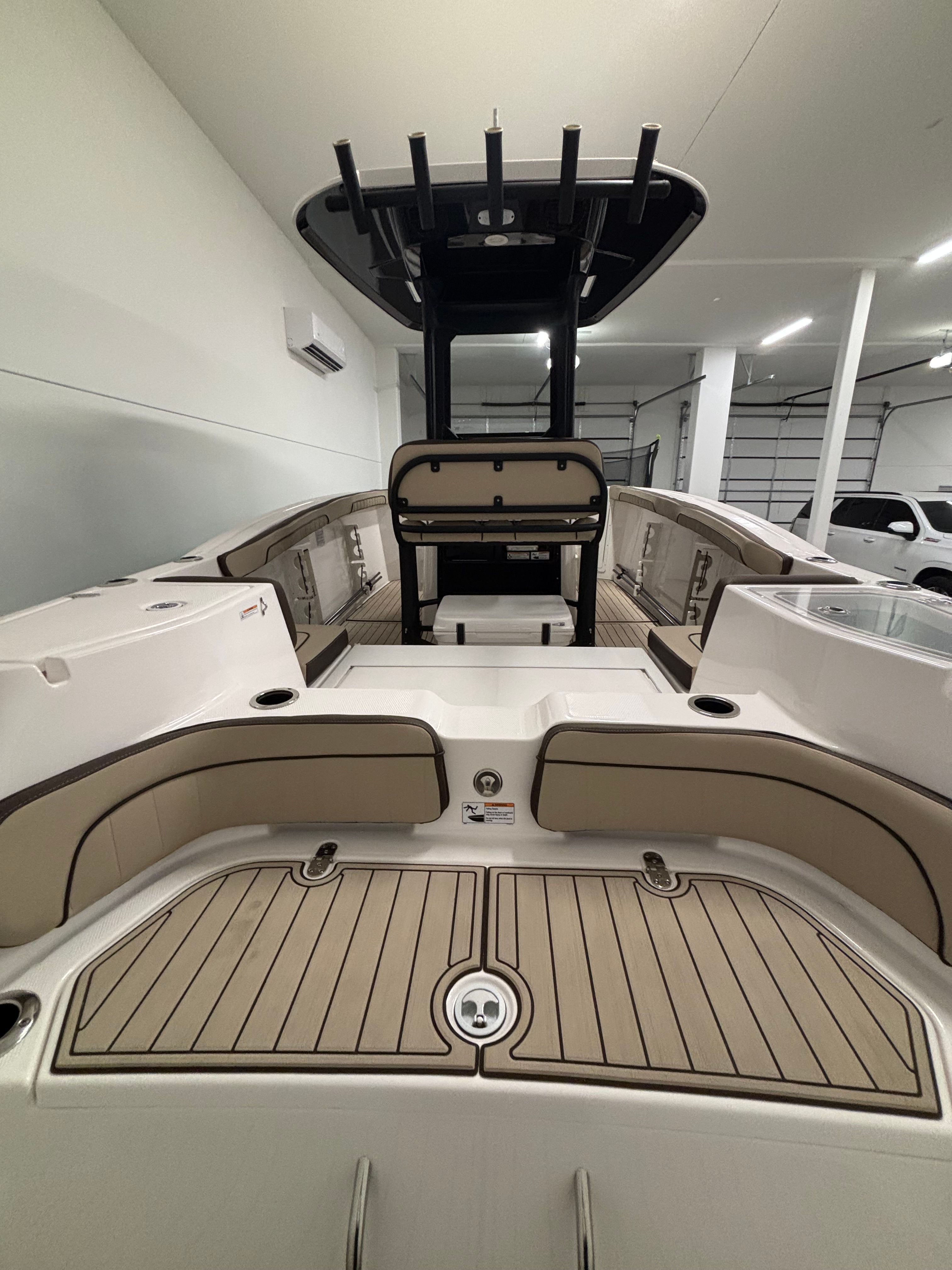 Interior view of a modern boat with sleek seating and a black T-top.