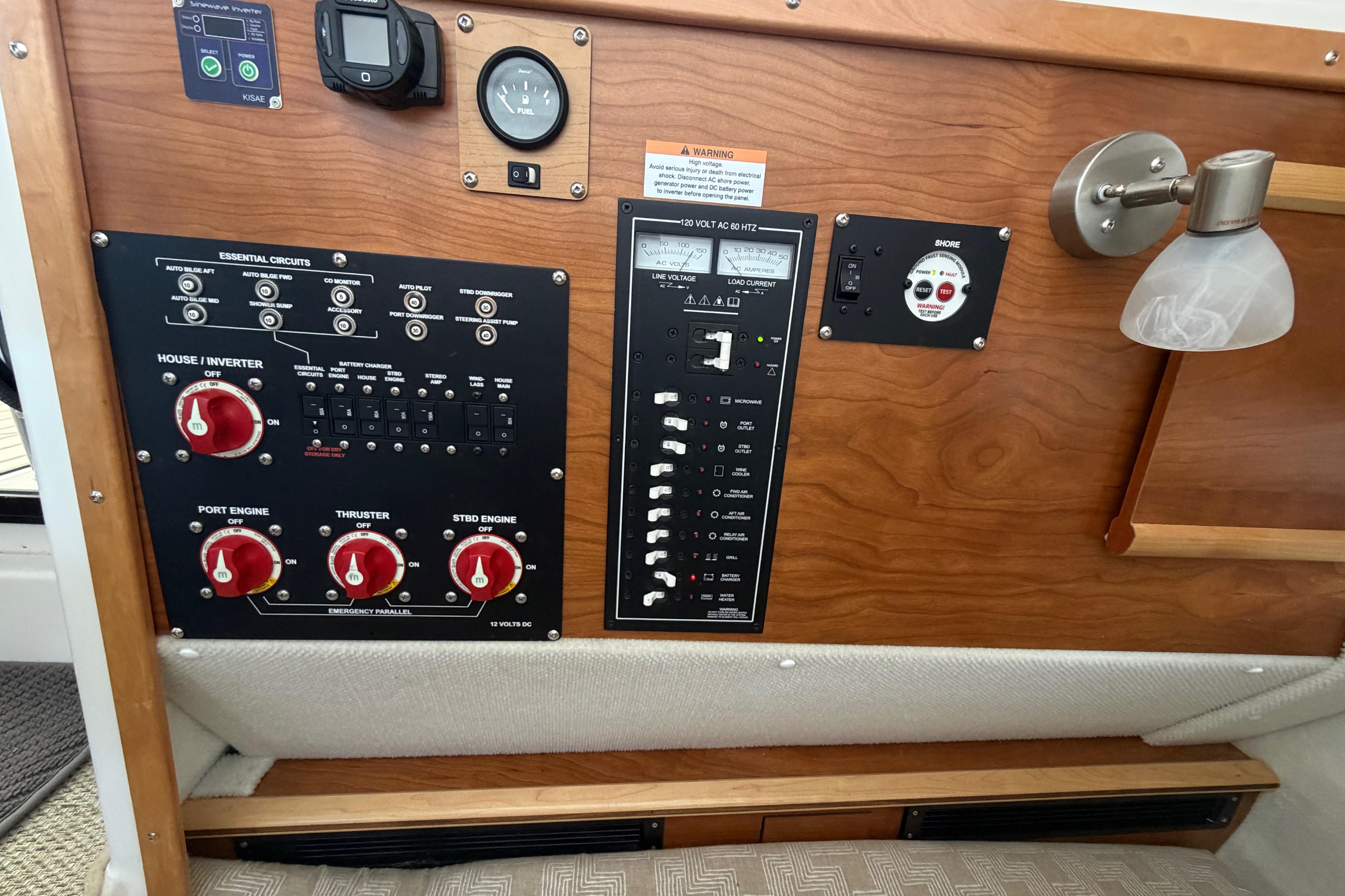 Control panel of 2023 Cutwater C-288 Coupe boat with switches and gauges.