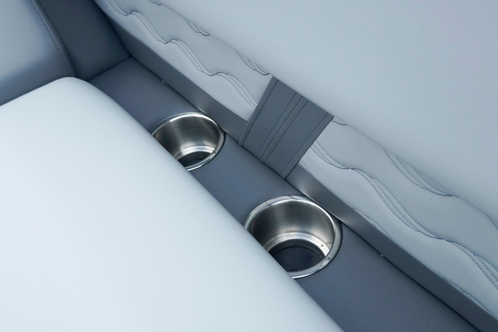 2025 SunCatcher Fusion 324RCX interior with dual stainless steel cup holders.