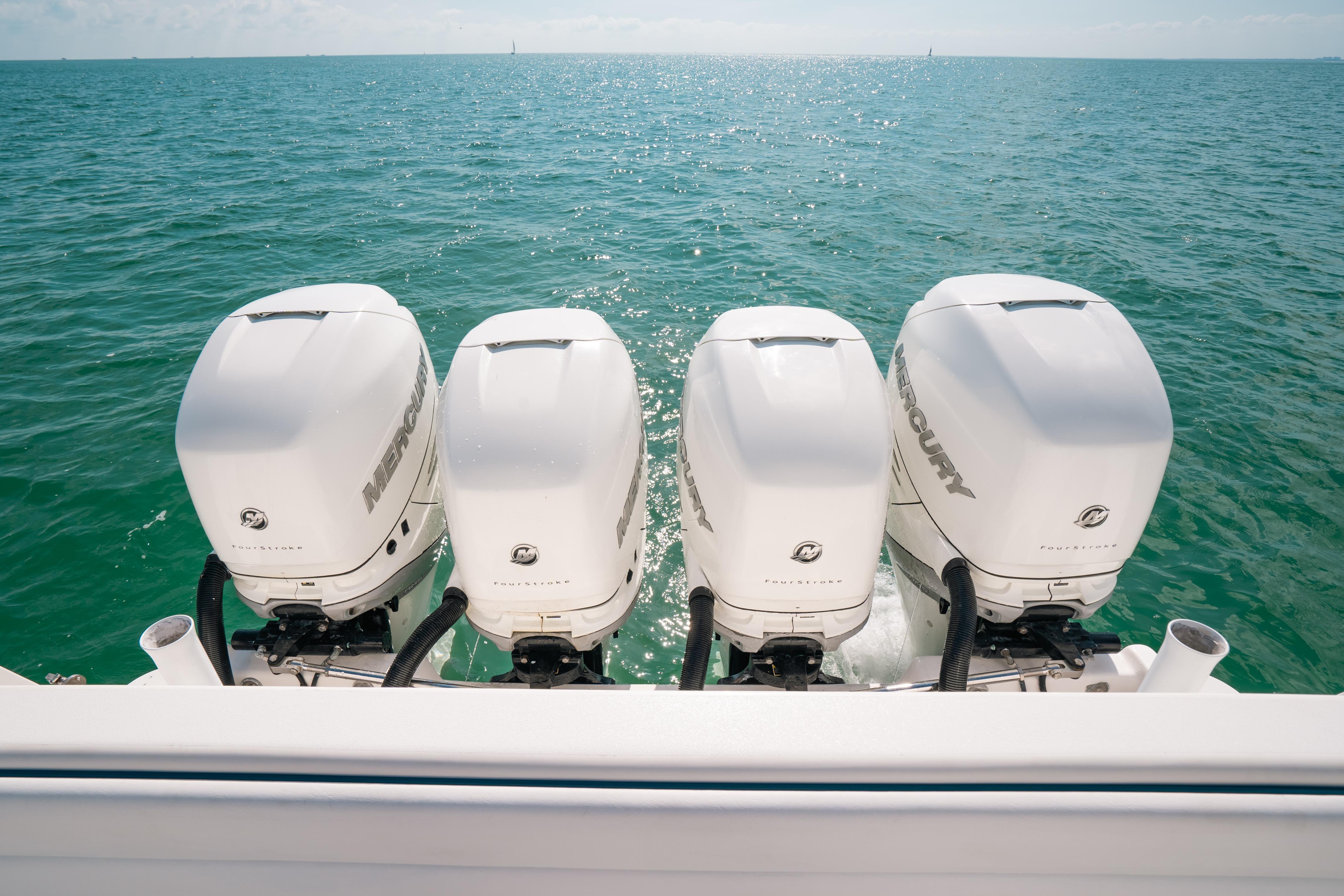 Four Mercury outboard engines on a 2009 Intrepid 475 Sport Yacht in open water.