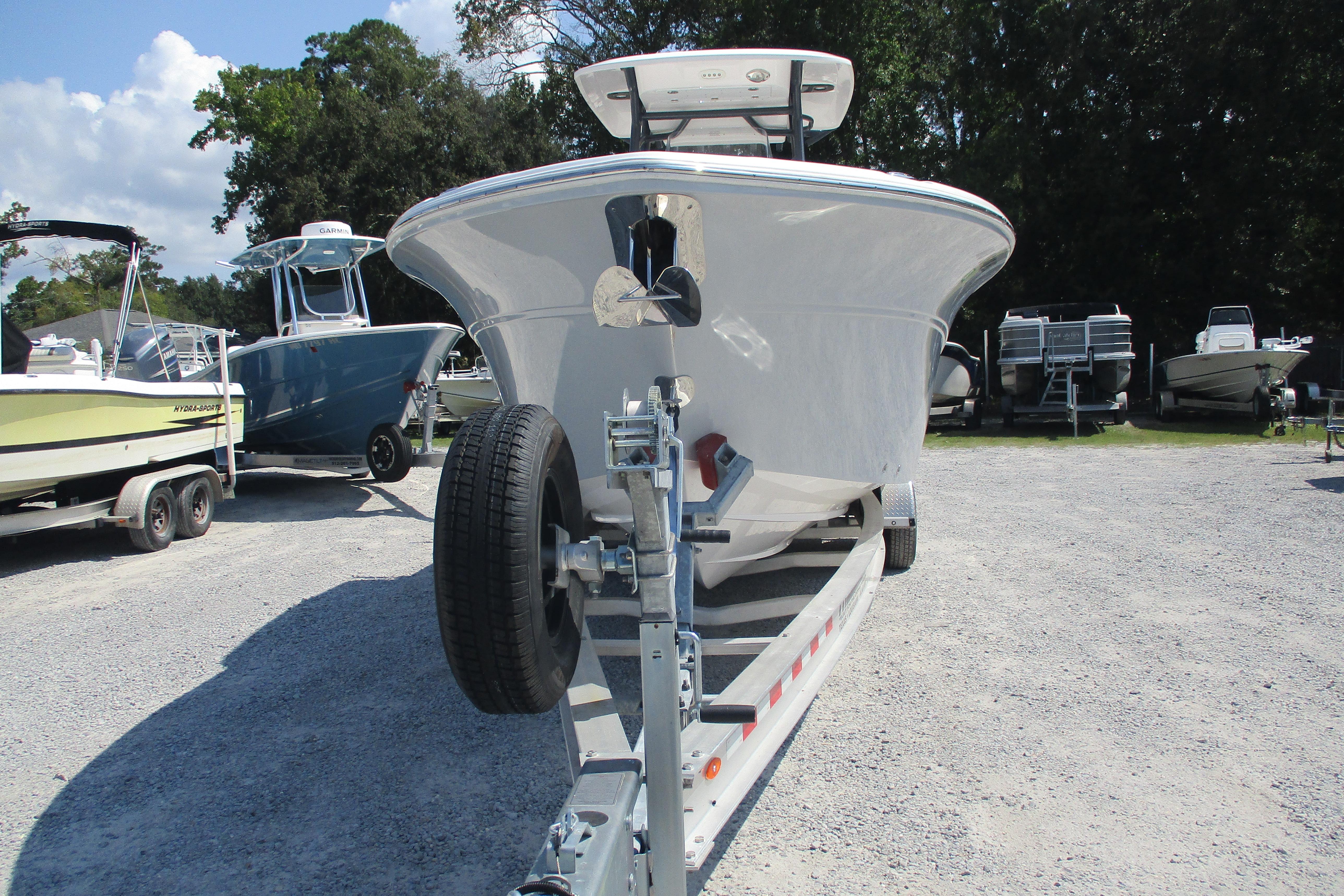 2024 Sea Fox 268 Commander boat on trailer in outdoor lot.