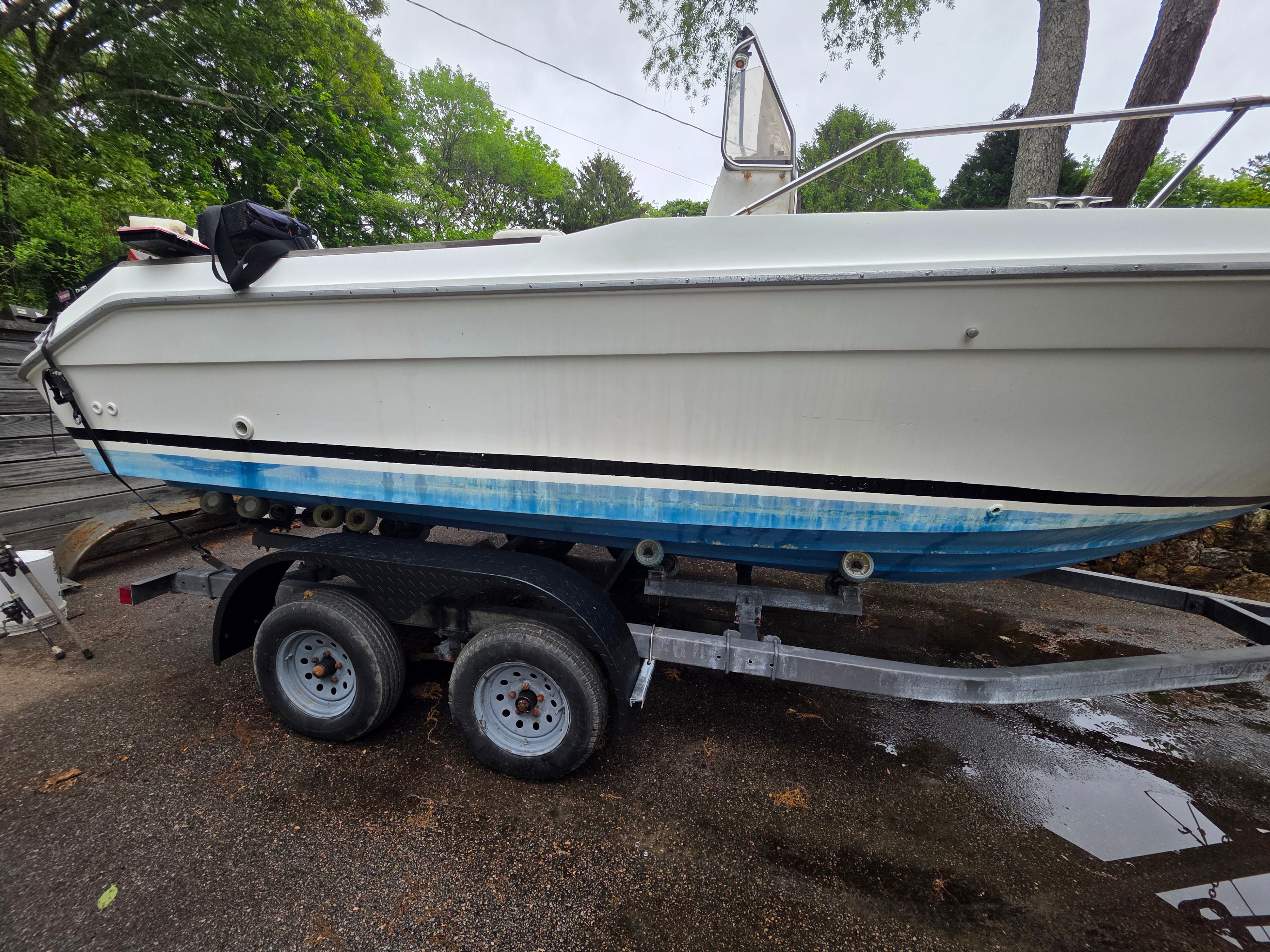 1989 Sea Ray Laguna boat on trailer, side view.