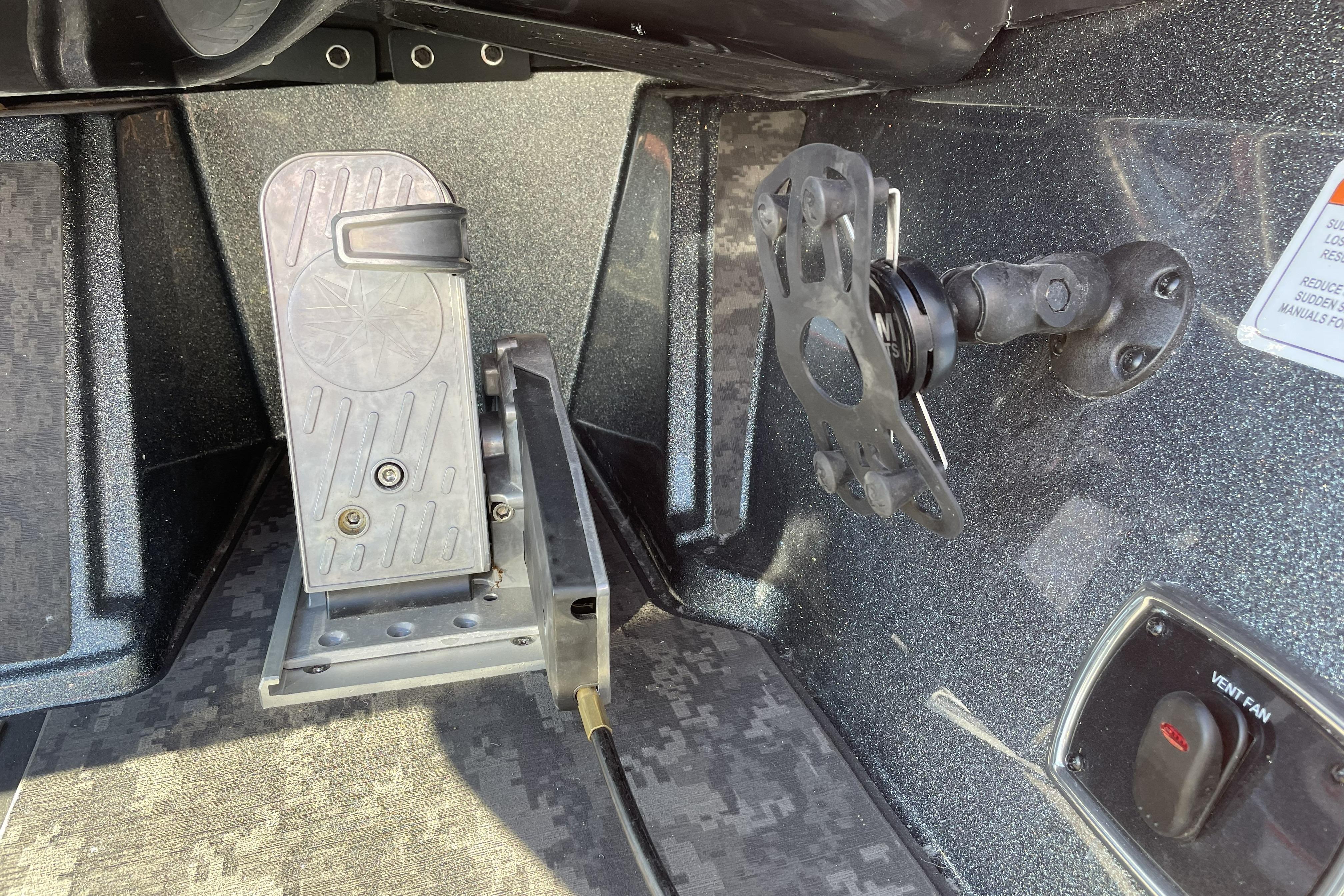 Foot pedal and mount inside 2026 Nitro Z20 XL boat cockpit.