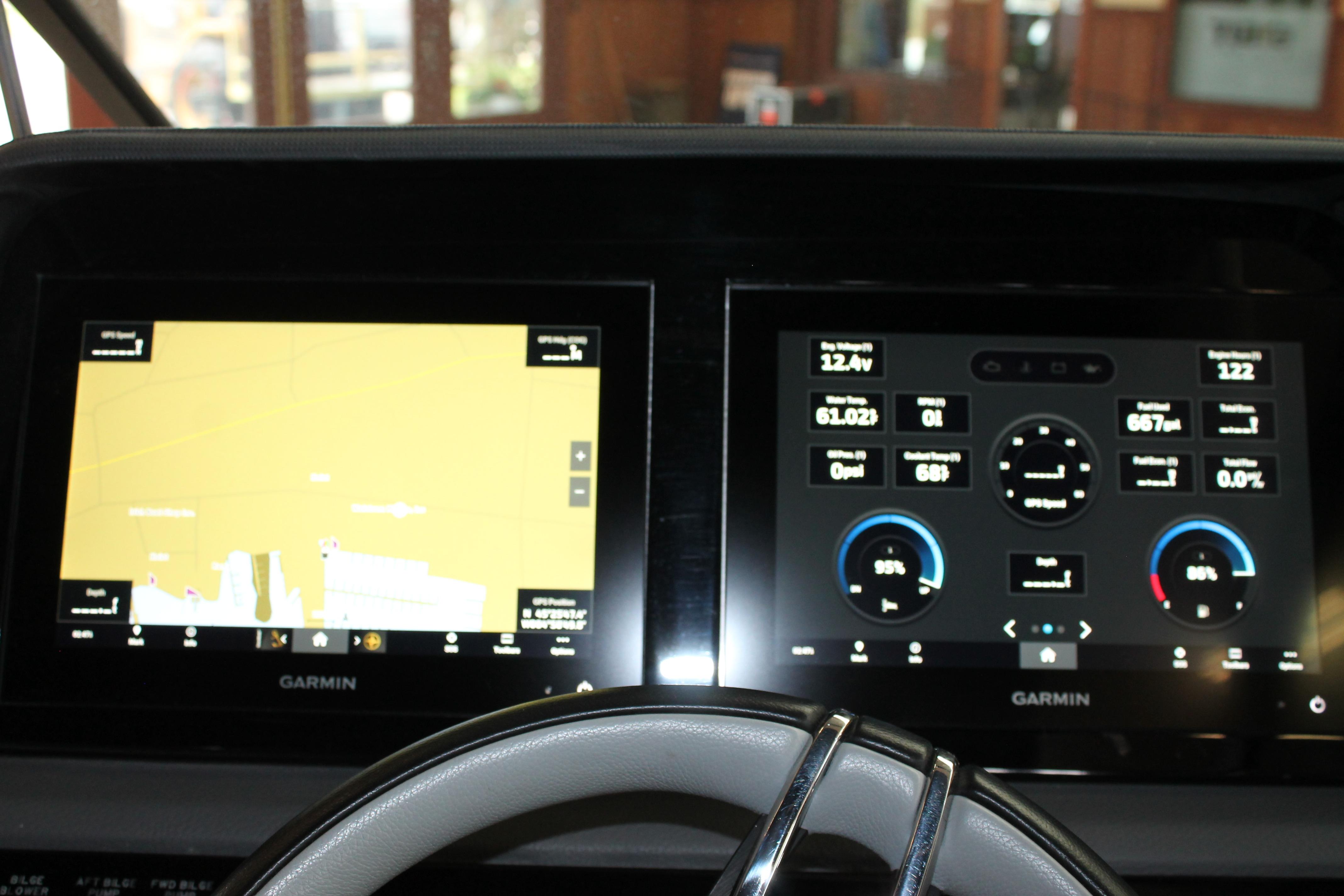 Dashboard of 2023 Cobalt R8 featuring dual Garmin displays with navigation and system information.