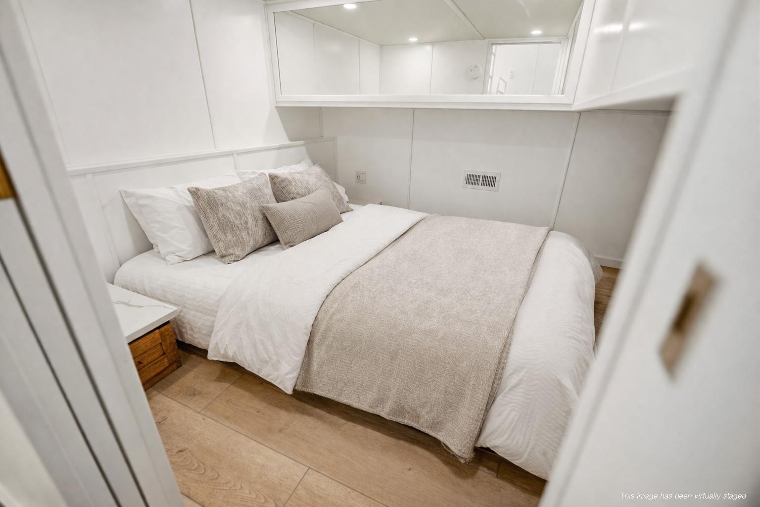 Luxurious bedroom interior on 2026 Sumerset Luxe III Show Boat, featuring elegant bedding and modern design.