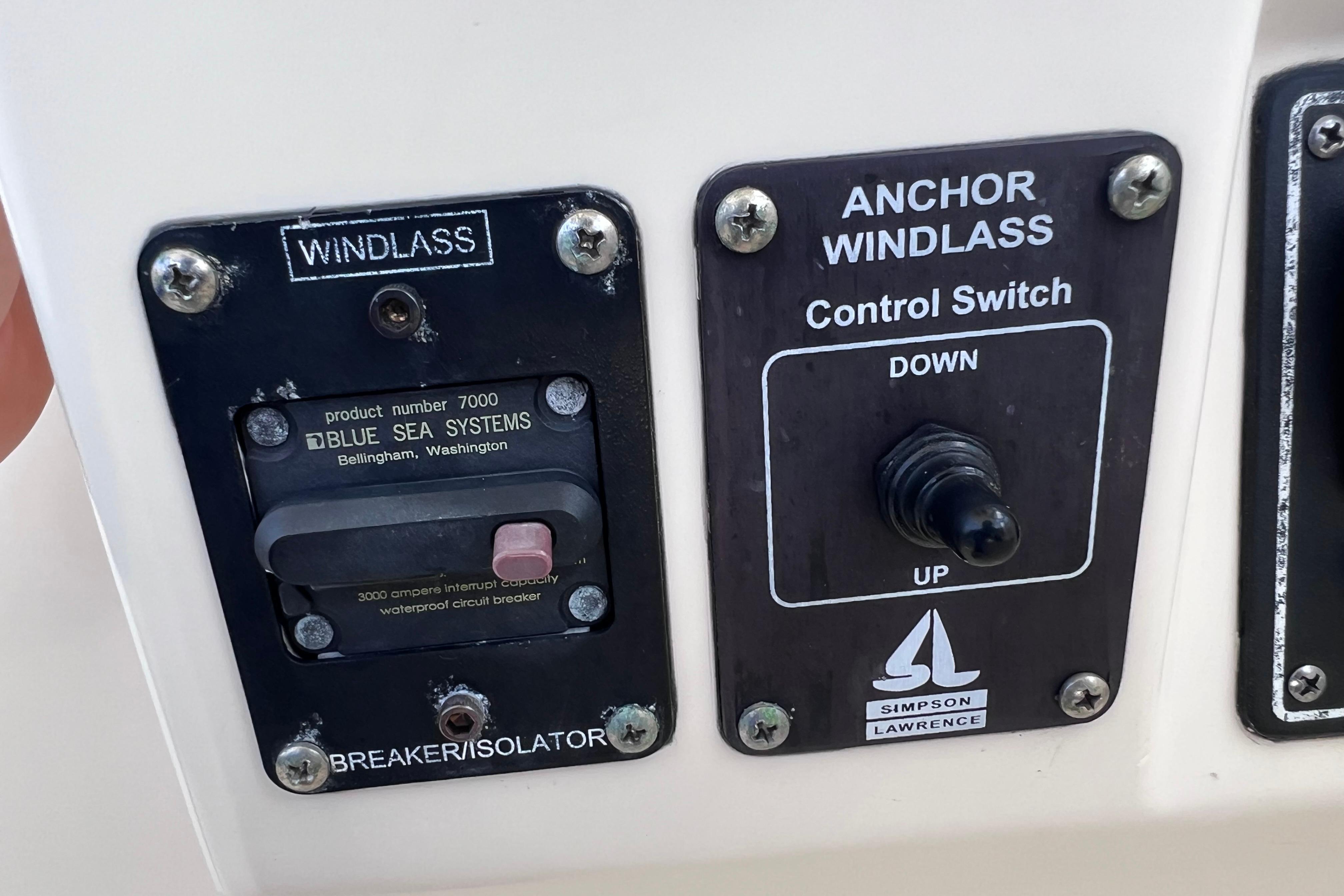 Control panel of a 2004 Pursuit 2870 Walkaround boat with windlass switch.