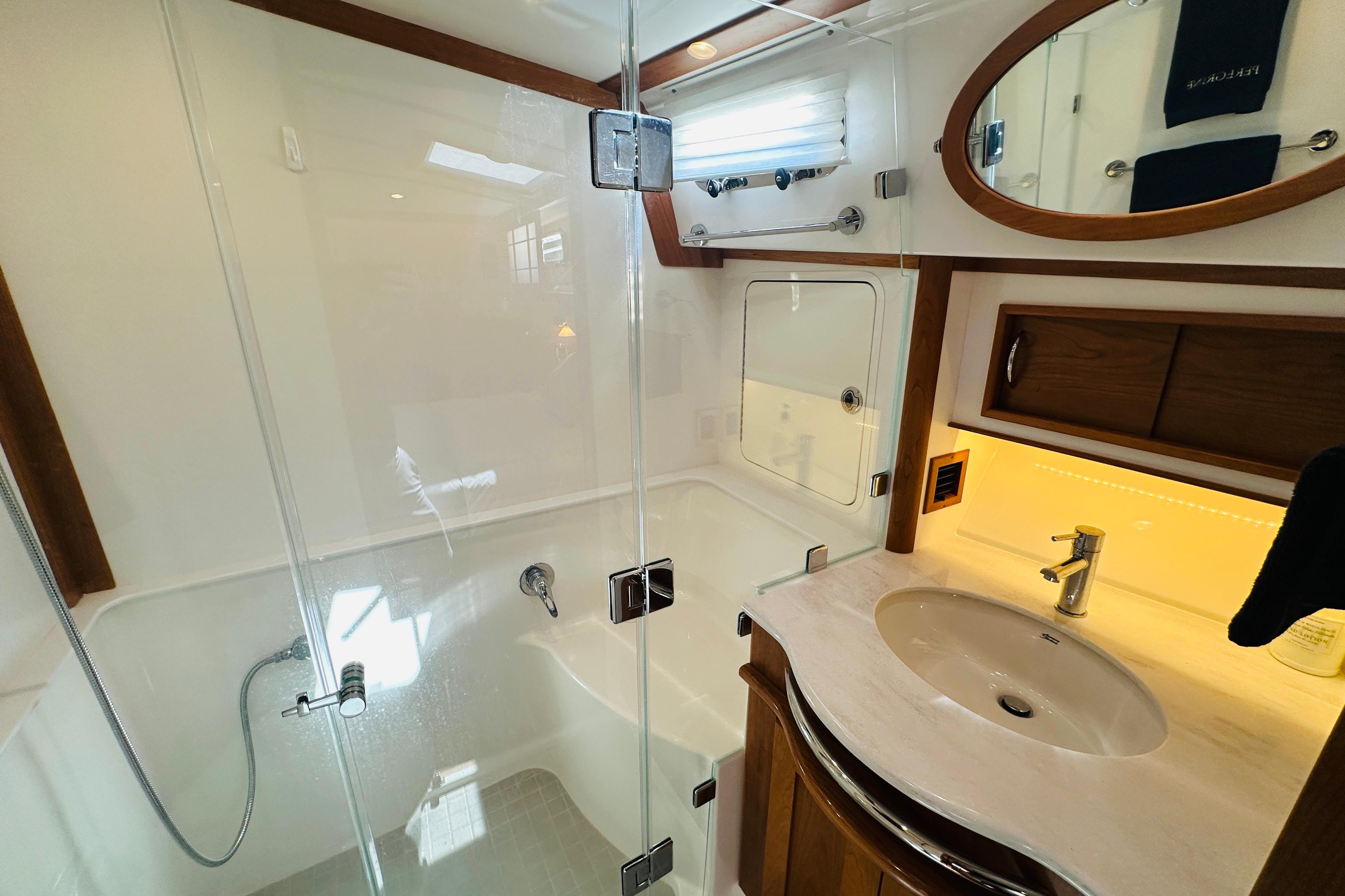 Luxurious bathroom in 2025 Sabre 48 Salon Express yacht with modern fixtures and elegant design.