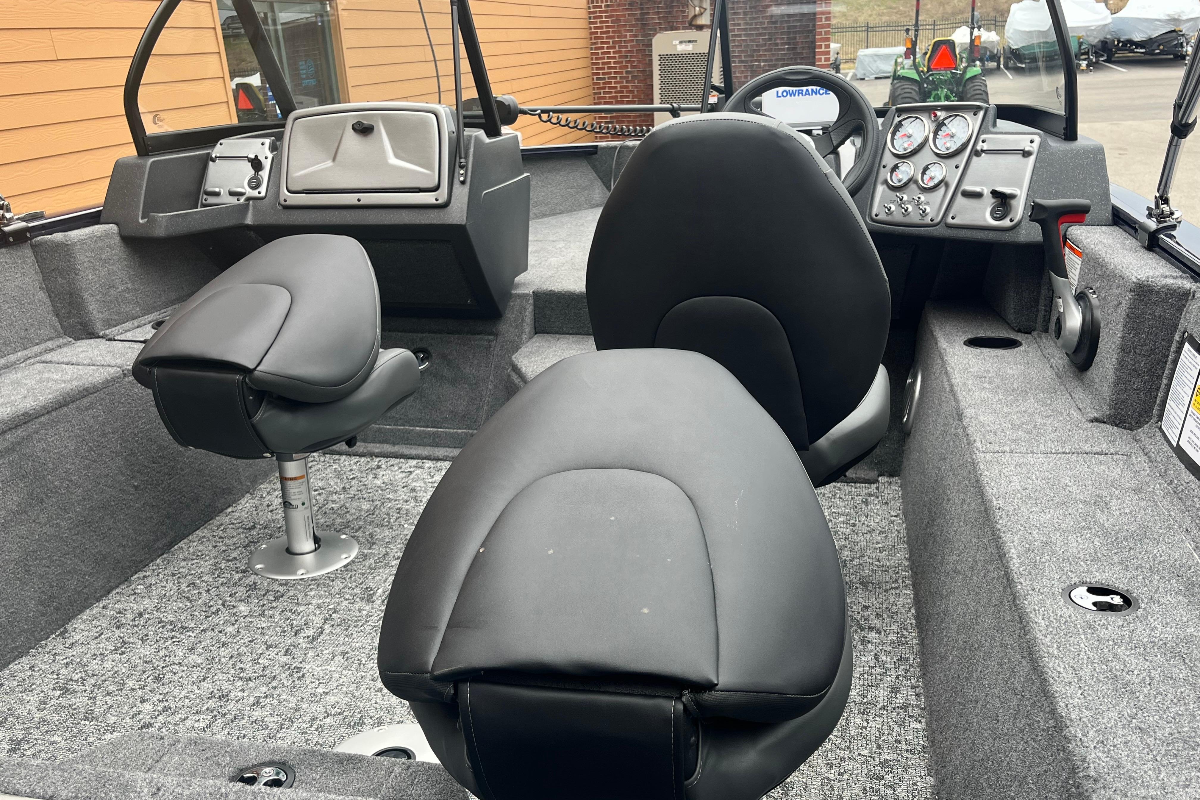 2026 Tracker Pro Guide V-175 WT boat interior with seating and control panel.