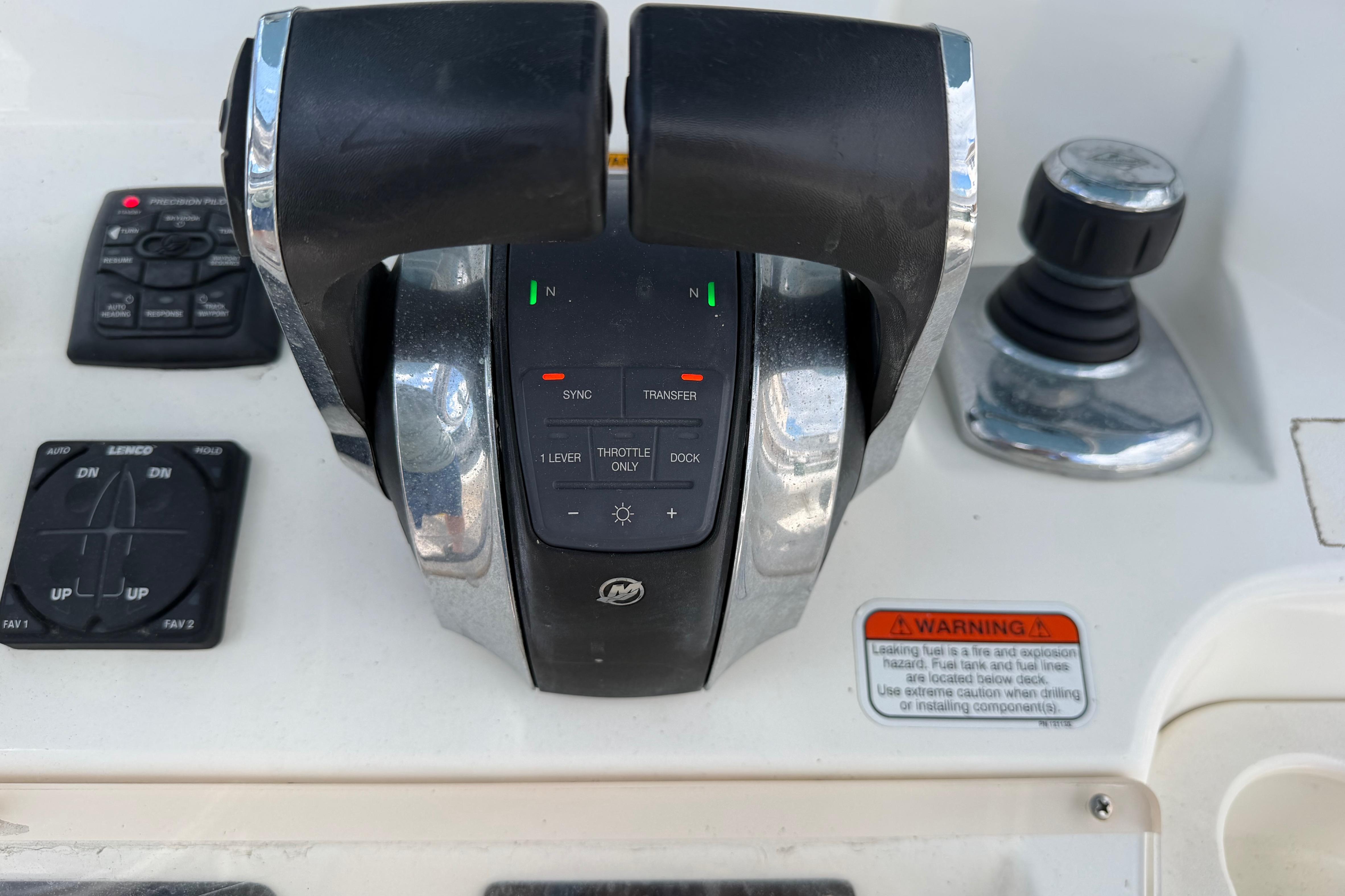Close-up of 2017 Mako 284 Center Console boat controls and throttle system.