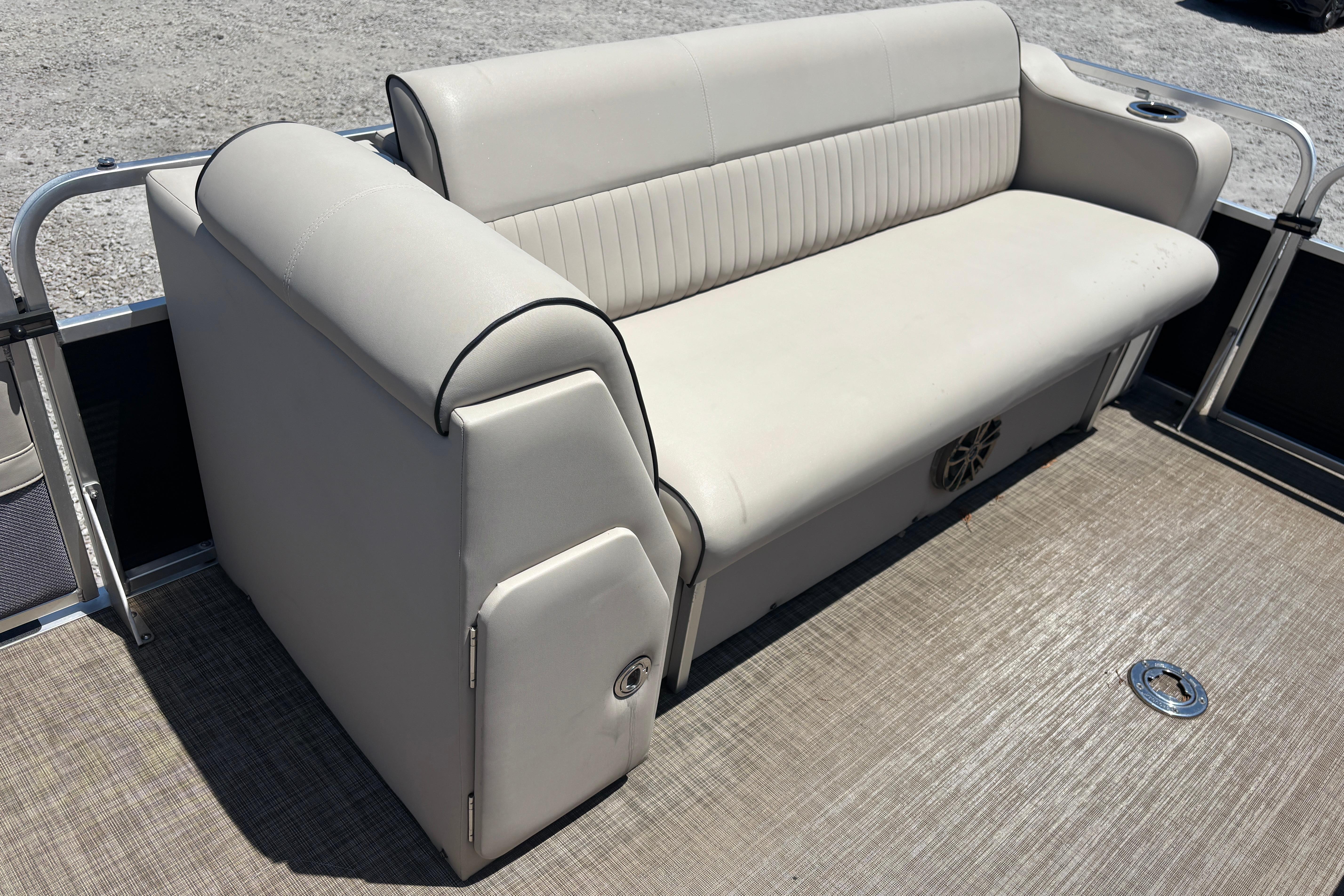 2017 Qwest LS 822 Bar boat with beige seating on deck.