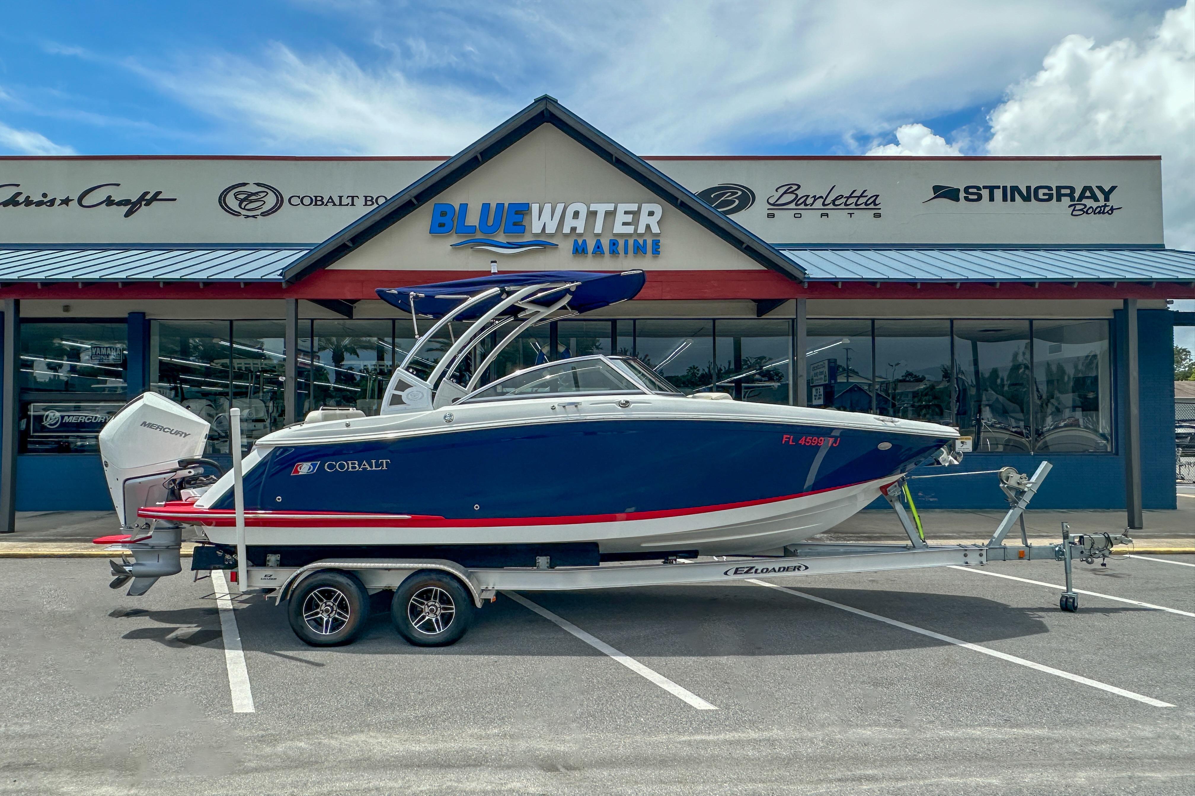 2022 Cobalt 25SC boat on trailer at Blue Water Marine dealership.