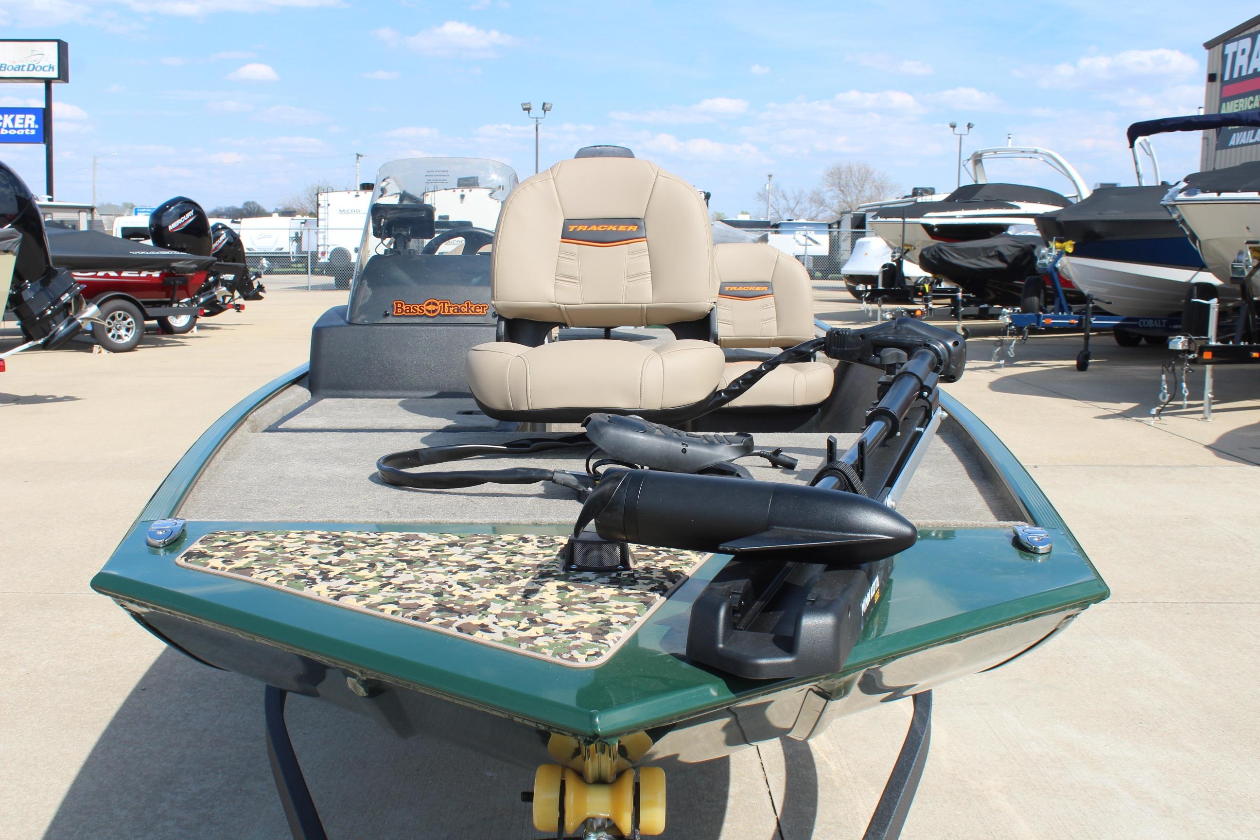 2026 Tracker Bass Tracker Classic Limited boat with camouflage deck, displayed outdoors.