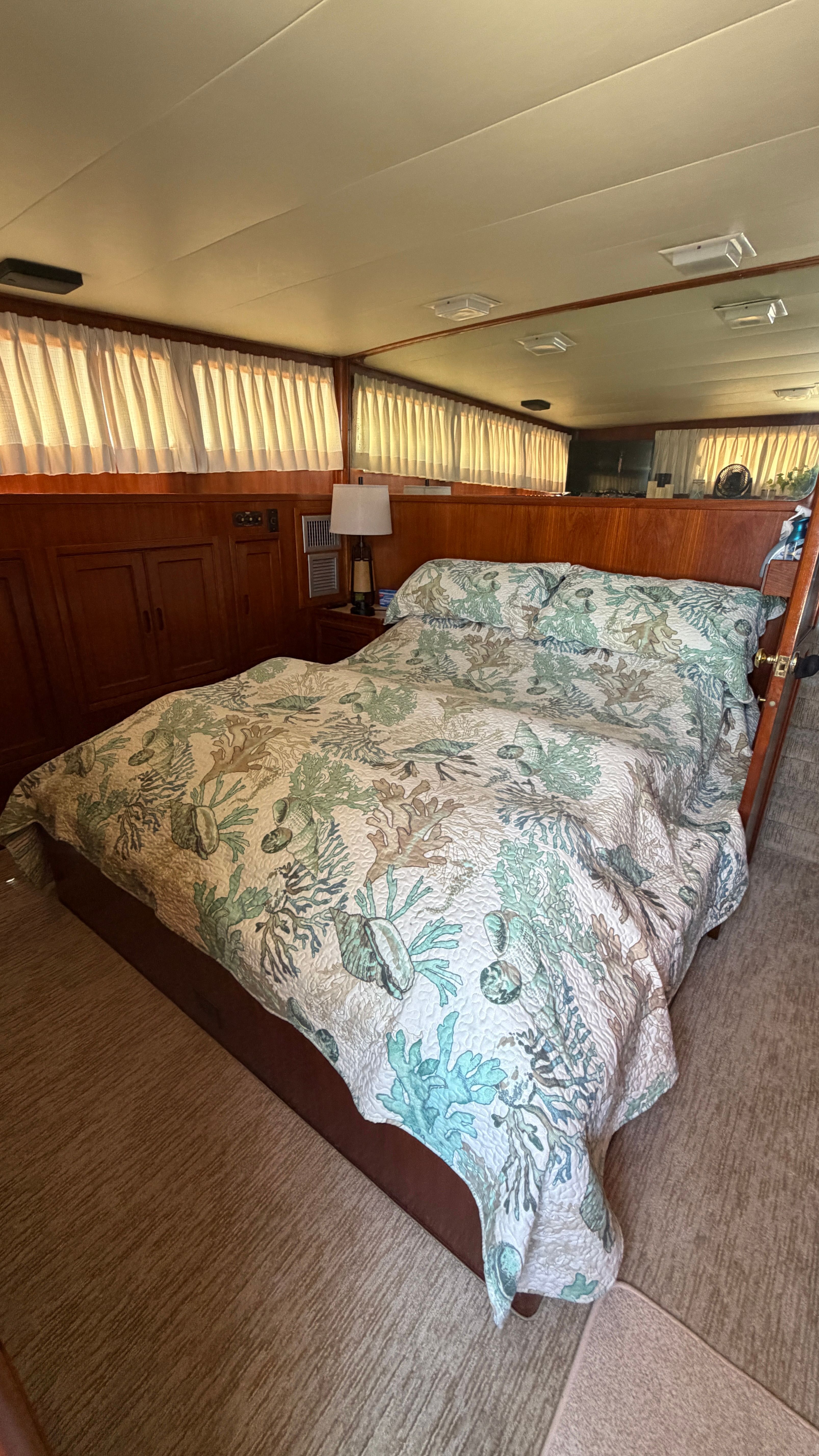 Interior of a 1966 Drake Yachtfisher with cozy bedroom.