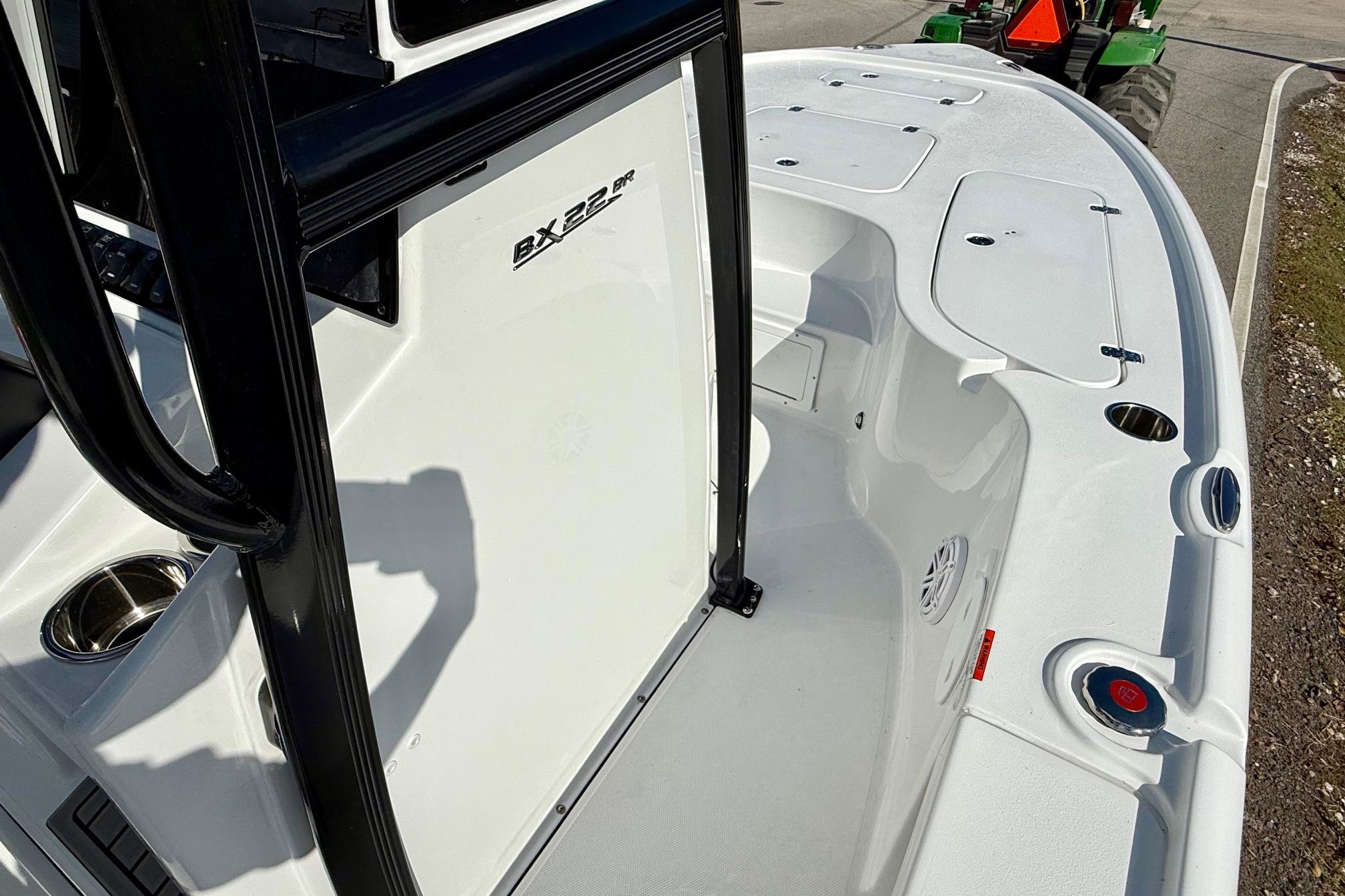 2026 Sea Hunt BX 22 BR boat deck with storage compartments and sleek design.