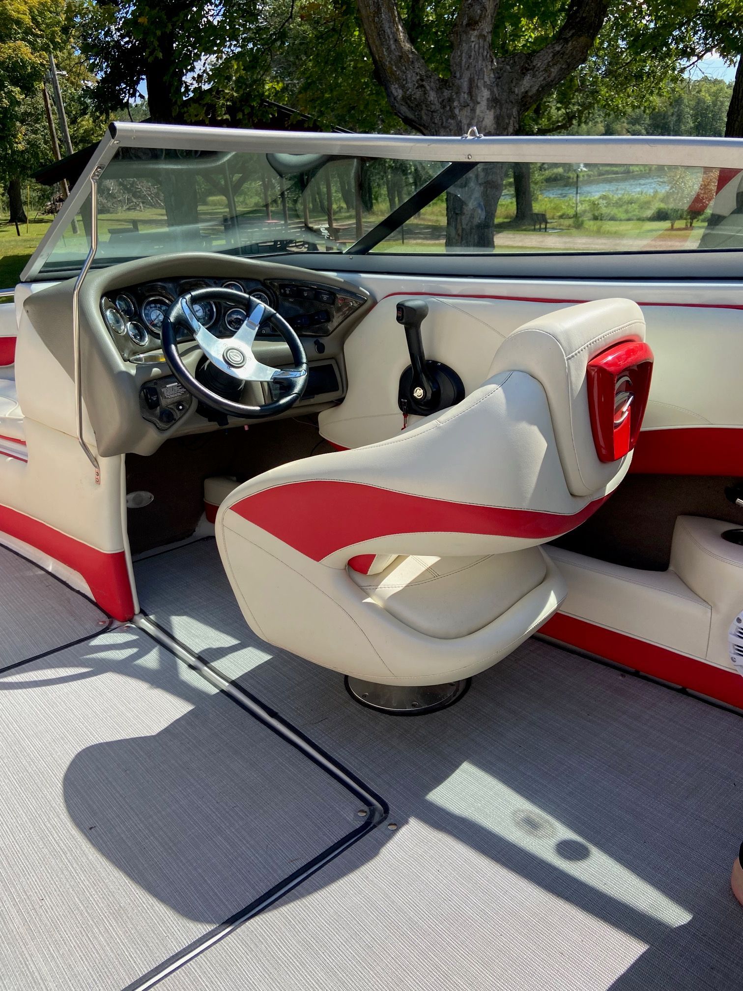 Interior of a 2011 Crownline 21 SS boat with red and white seating.