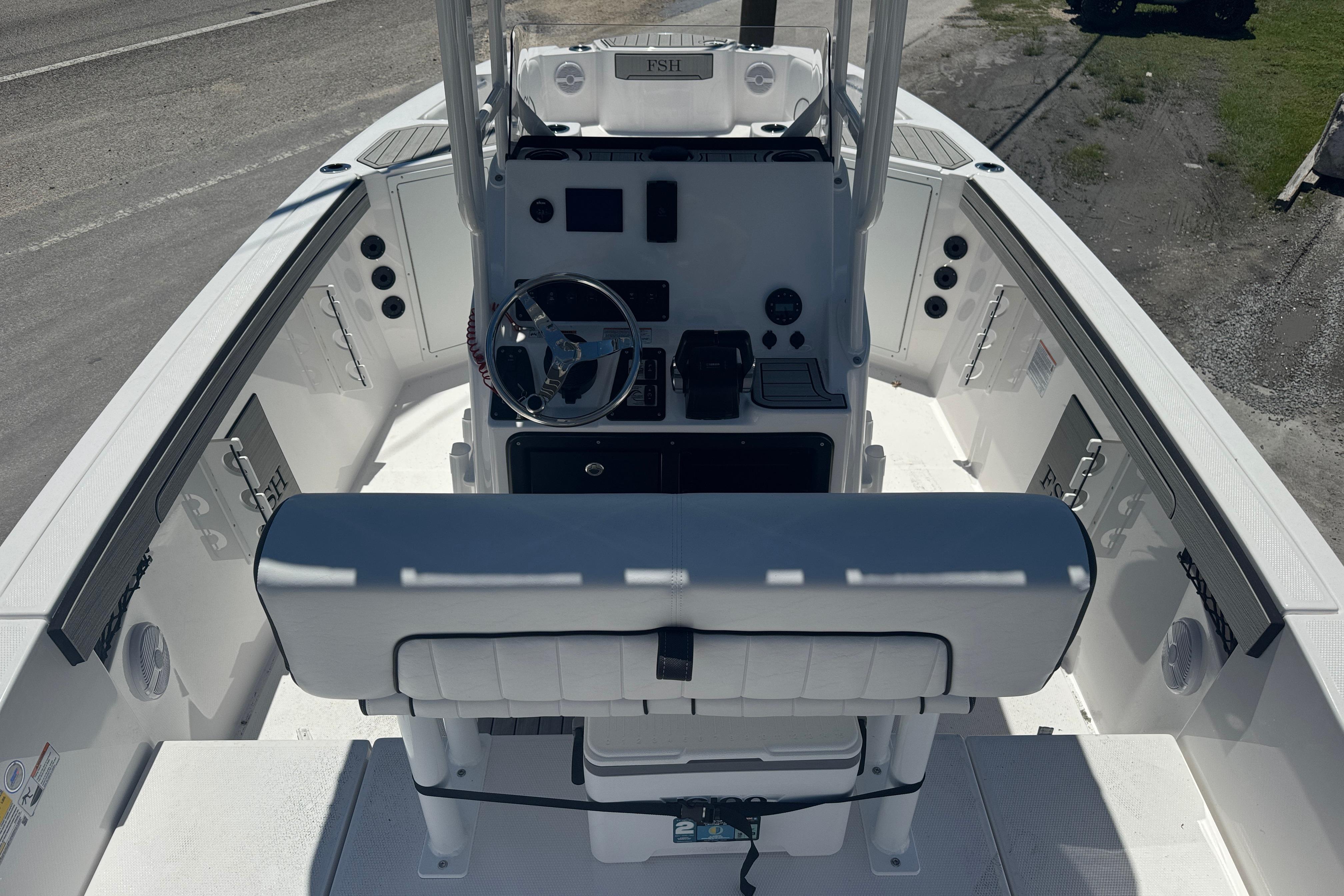 2026 Yamaha Boats 220 FSH Sport interior, featuring helm and seating area.