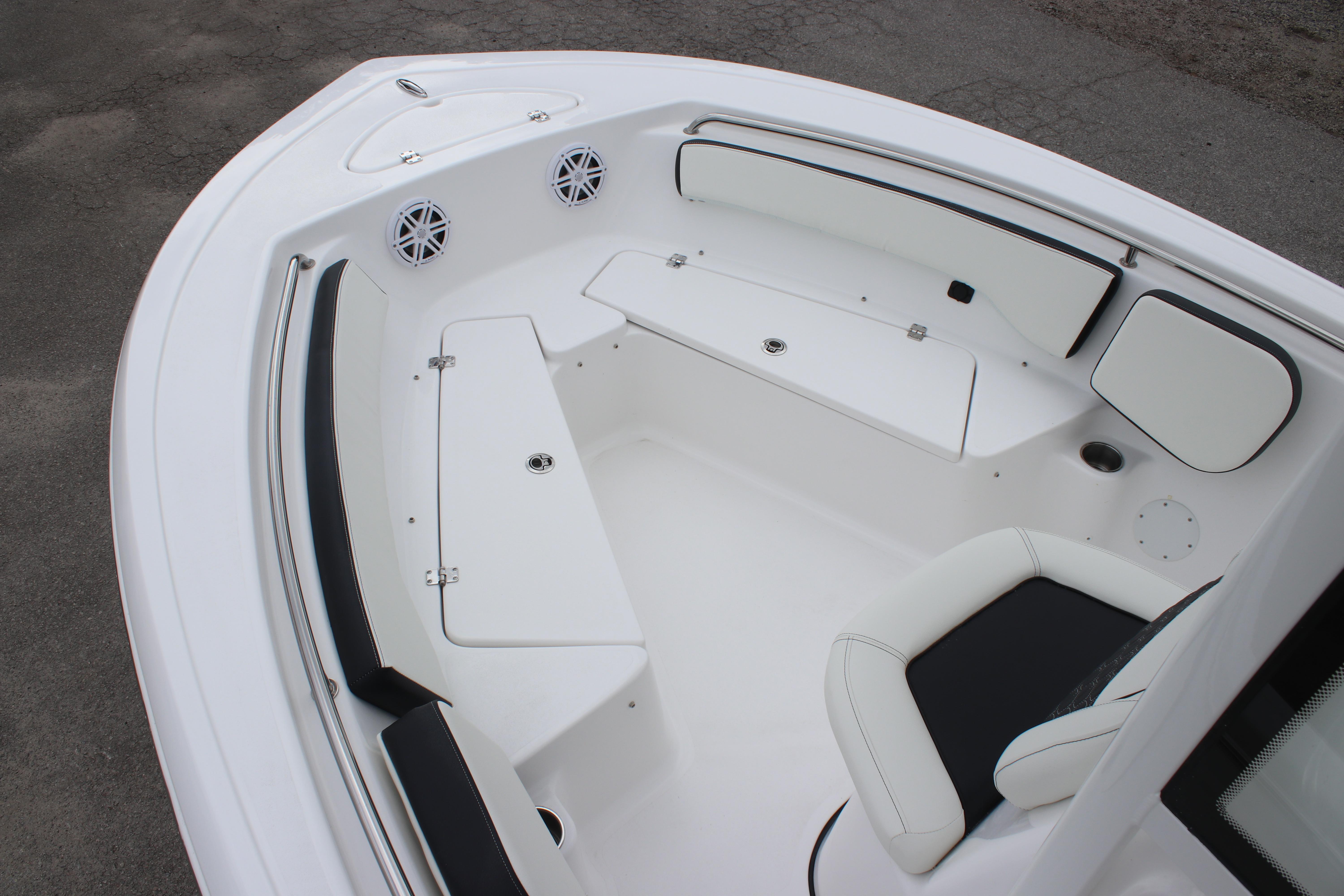2026 Tidewater 198 CC Adventure boat interior with white seating and storage compartments.