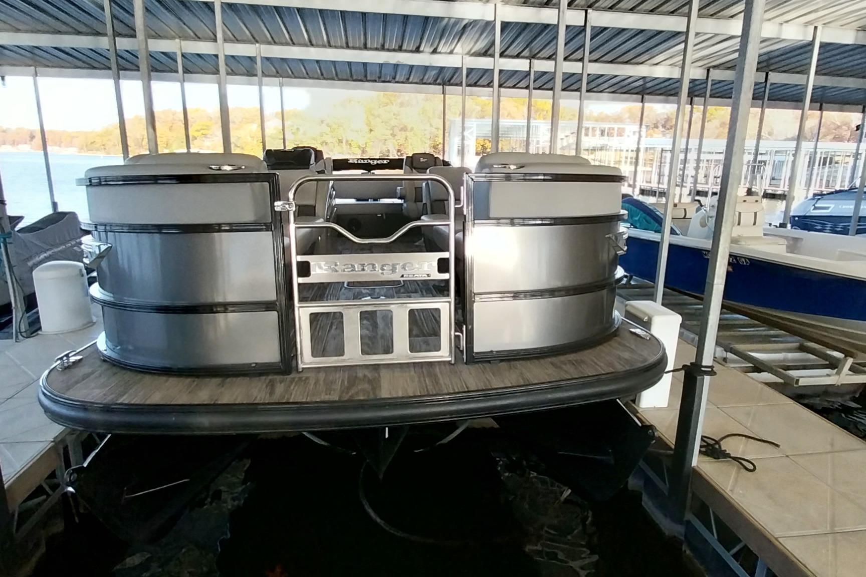 2023 Ranger 2500LS pontoon boat docked in a covered marina.
