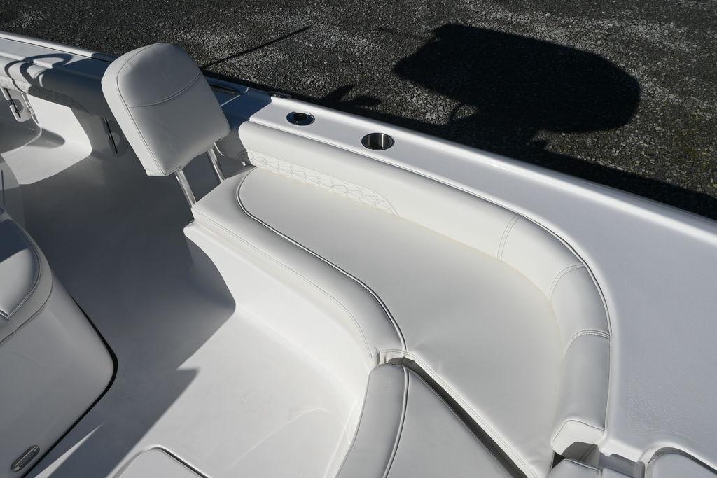 2026 Tidewater 2500 Carolina Bay boat interior with white cushioned seating.