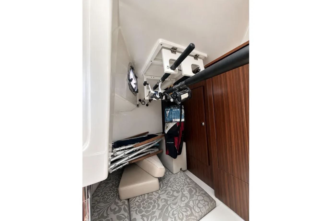 Interior of 2016 Pursuit OS 325 Offshore with fishing rod holder.