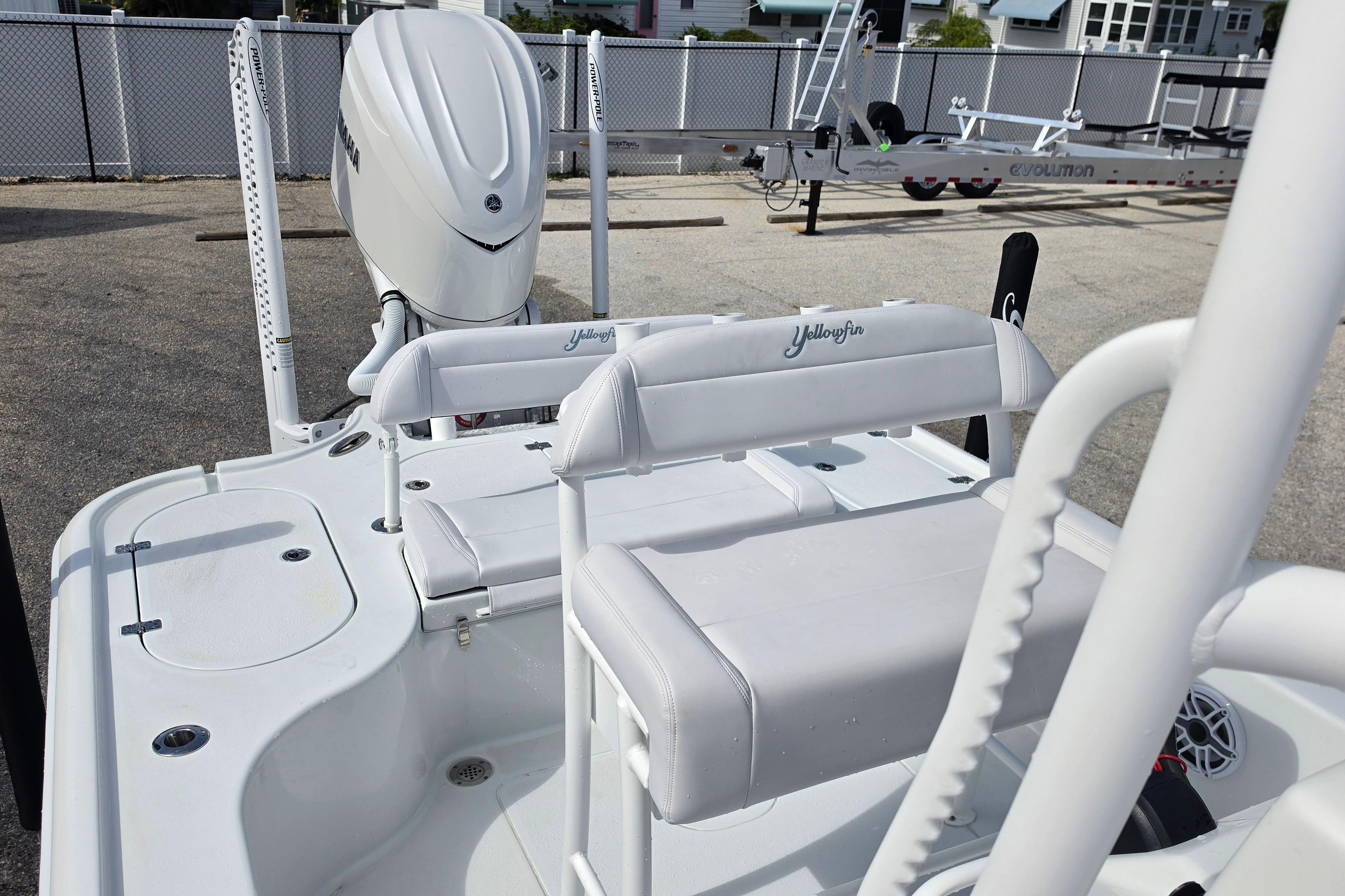 2026 Yellowfin 24 Bay CE boat with white seating and Yamaha engine.