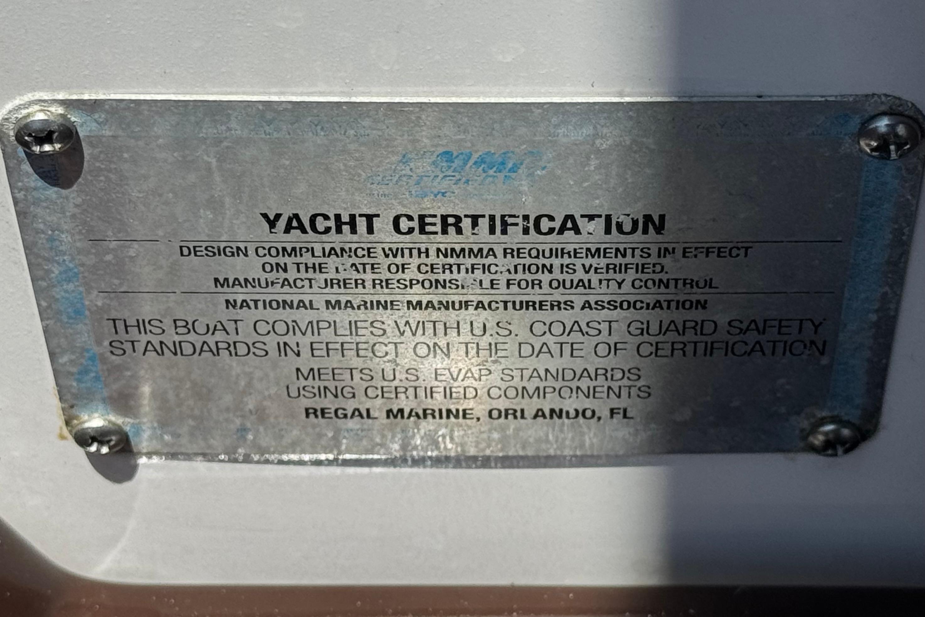 Yacht certification plaque for 2013 Regal 28 Express, meeting U.S. Coast Guard safety standards.