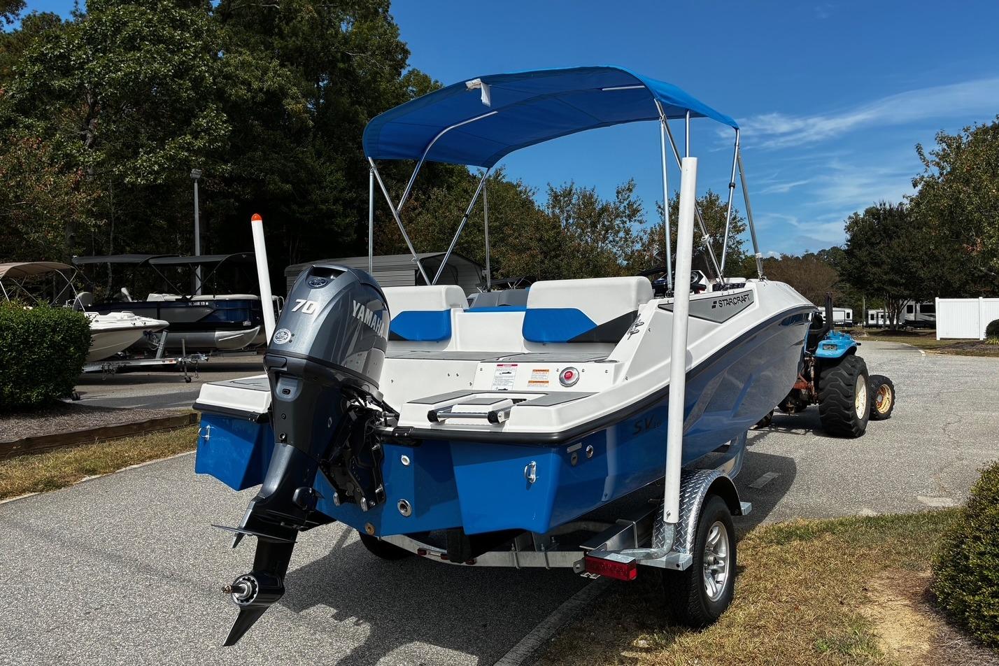 2026 Starcraft SV 16 OB boat with Yamaha motor on trailer, parked outdoors.