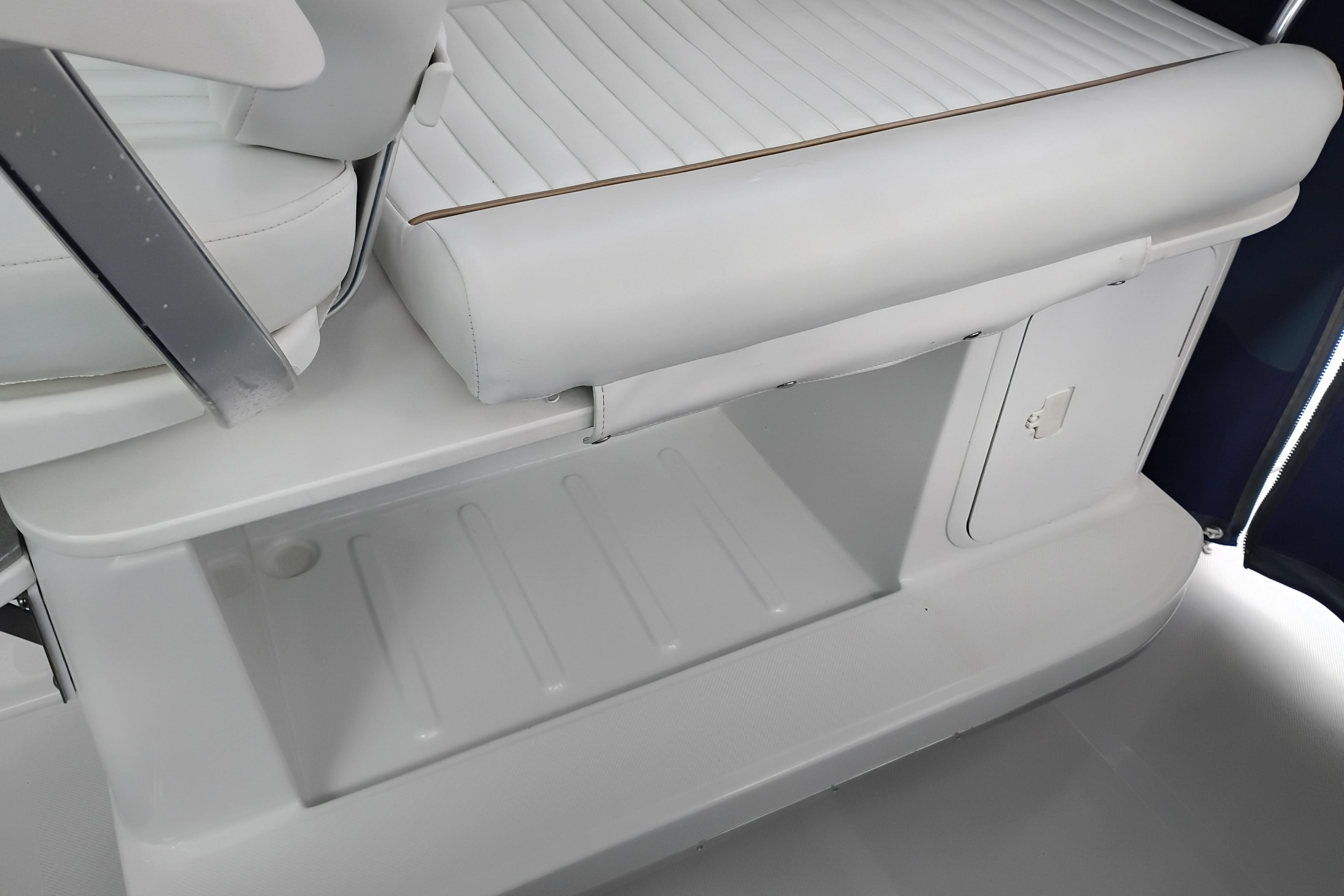 2007 Glacier Bay 2685 Coastal Runner interior seating and storage compartment.