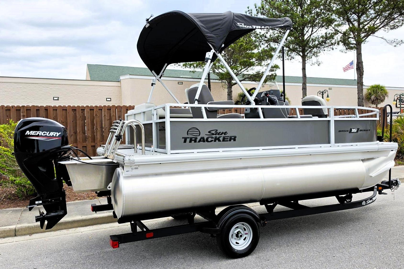 2026 Sun Tracker Bass Buggy 16 XL Select pontoon boat with Mercury outboard motor.