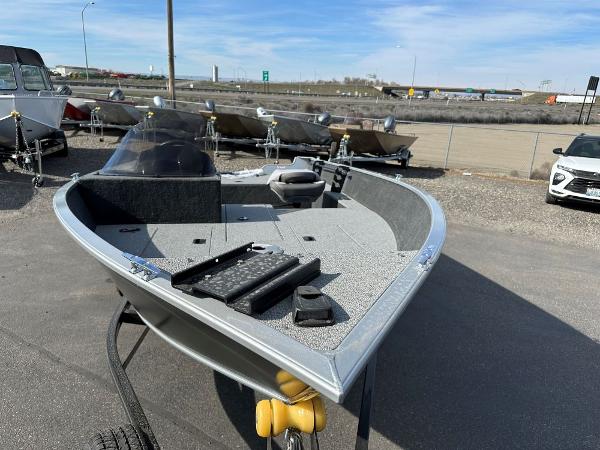 2024 Starweld 16 Fusion SC Pro fishing boat on display in a dealership lot.