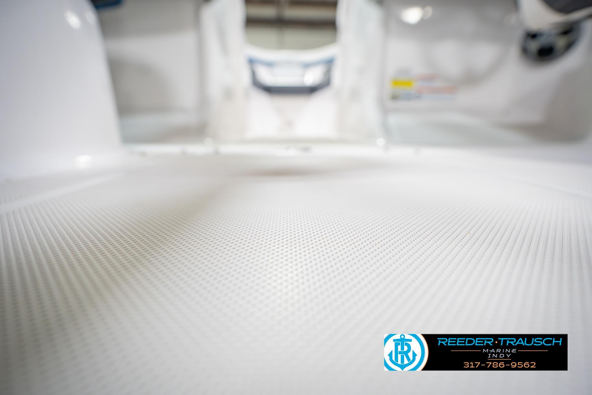 2015 Regal 2000 ESX Bowrider interior with textured flooring, Reeder Trausch Marine logo.