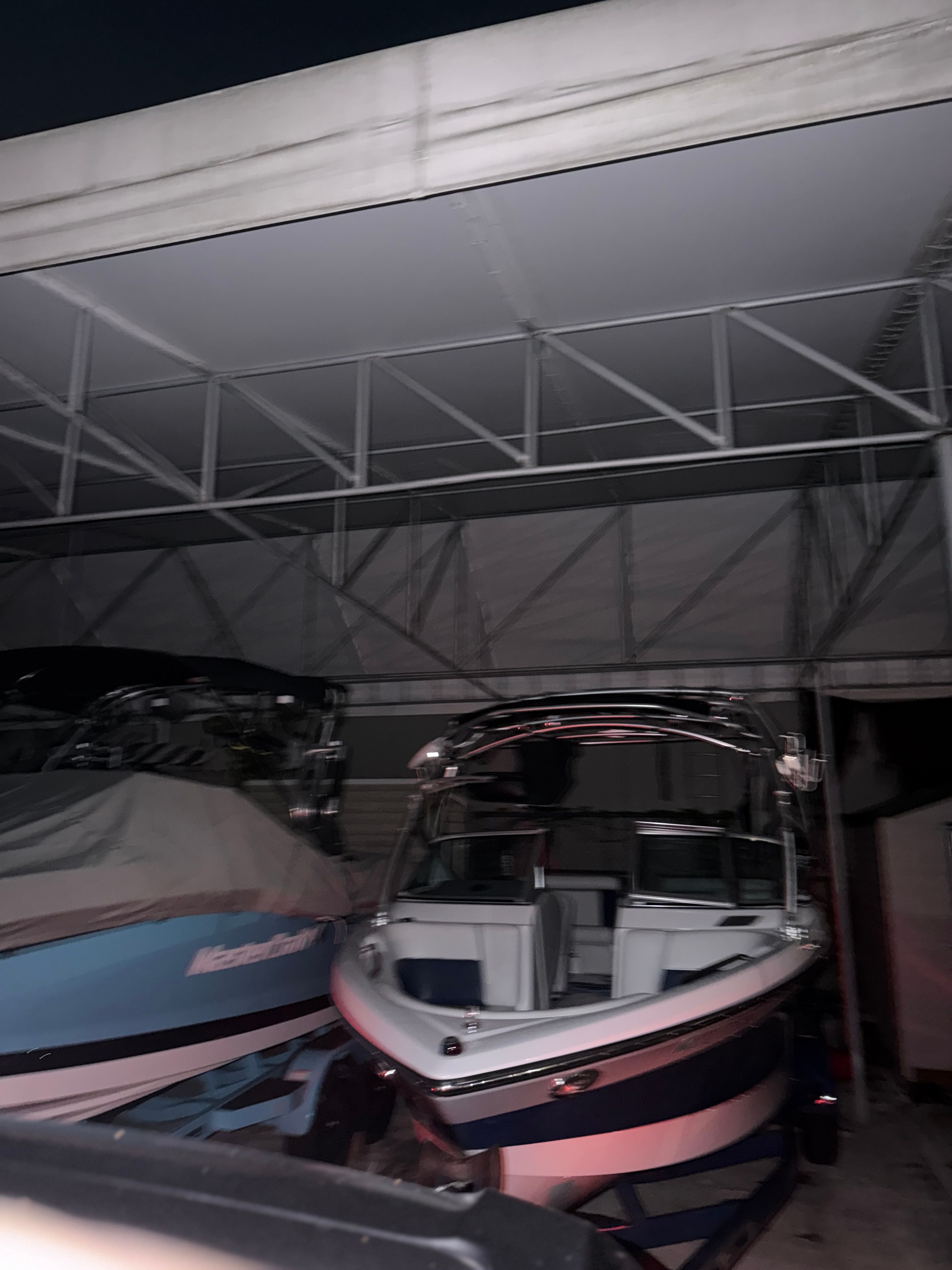 2008 Nautique 236 Team Edition boat in covered storage.