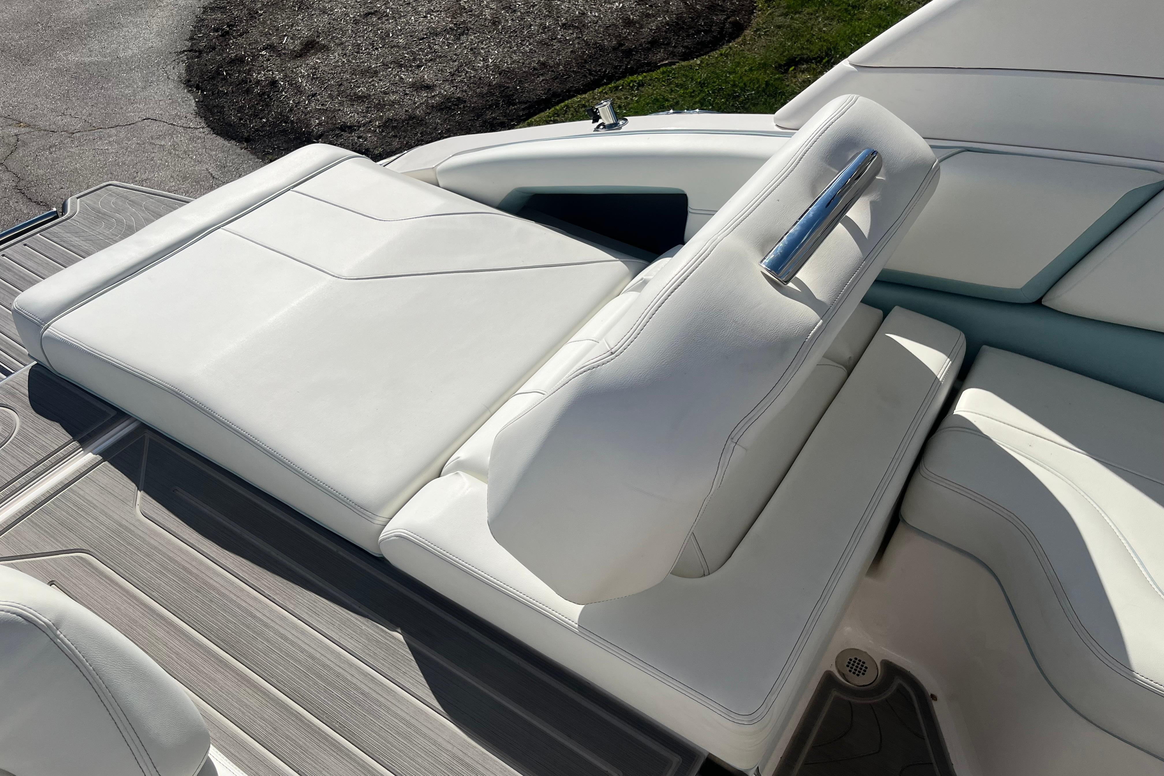 2024 Regal LS9 Surf boat with white leather seating and sleek design.