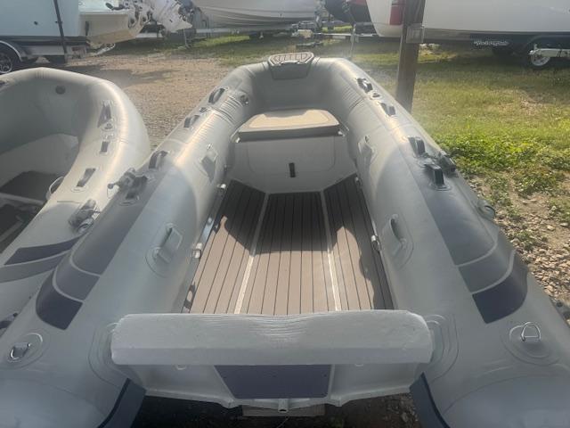 2025 Highfield Classic 290 inflatable boat, gray, parked outdoors.