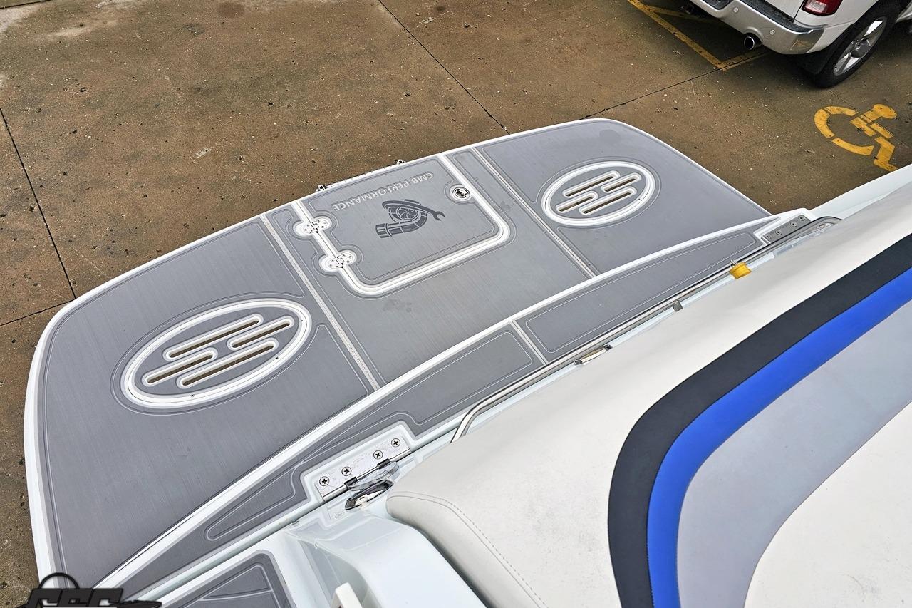2008 Baja 335 Performance boat swim platform with sleek design and integrated speakers.