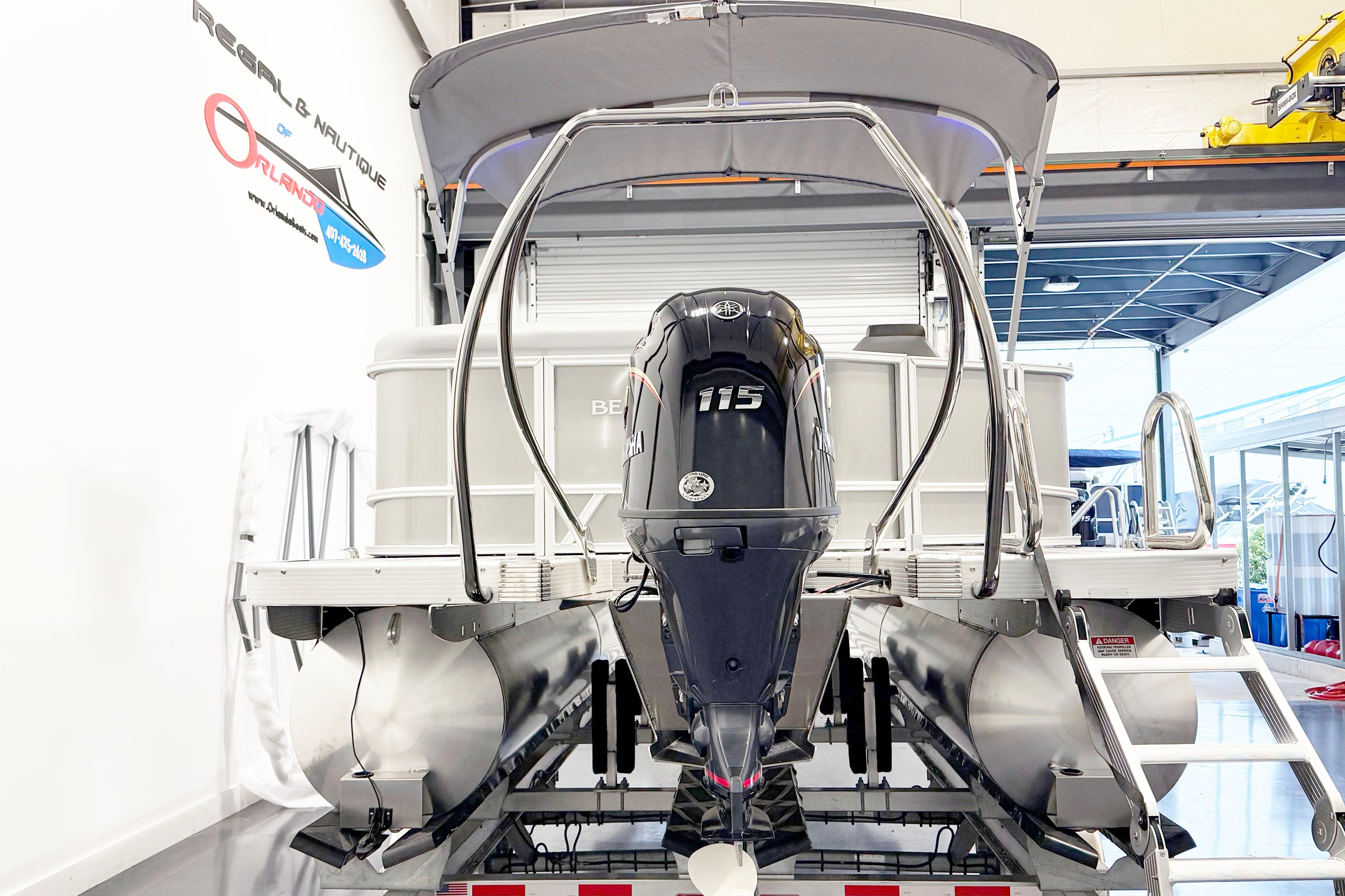 2025 Bennington 21S Cruise pontoon boat with Yamaha 115 engine in showroom.