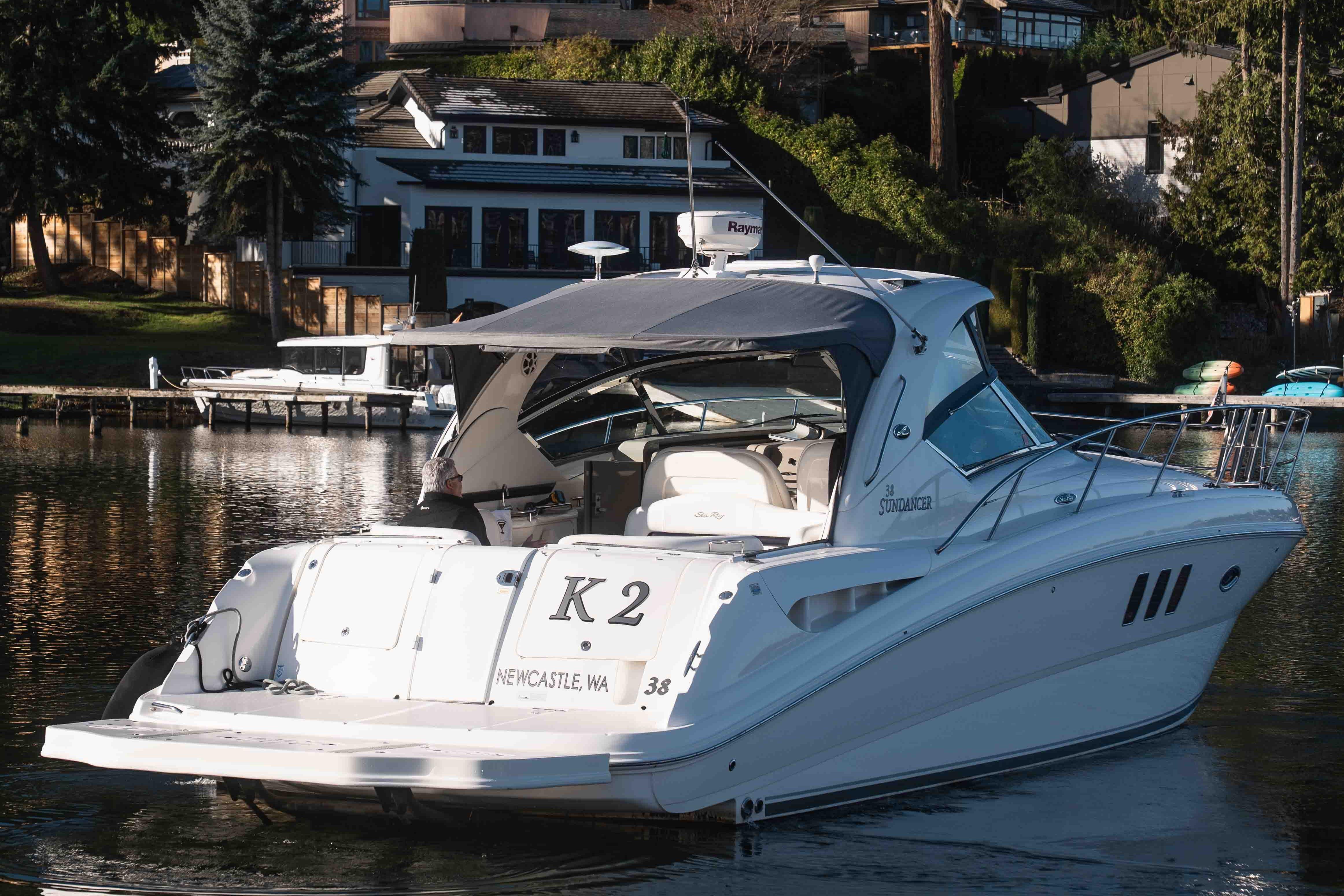 2008 Sea Ray 38 Sundancer yacht docked in a scenic waterfront setting.