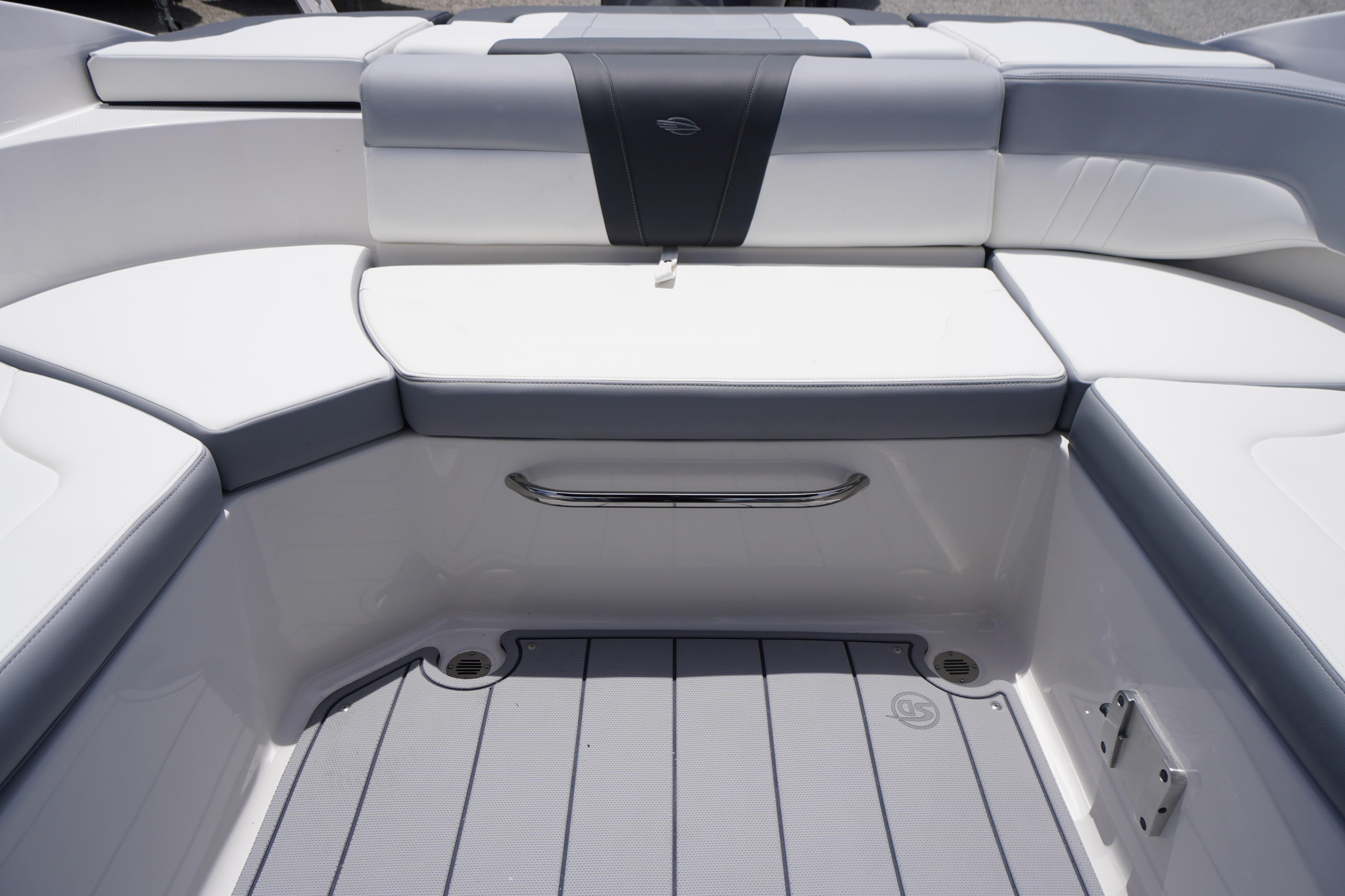 2026 Chaparral 23 SSi OB boat interior with sleek white and gray seating.
