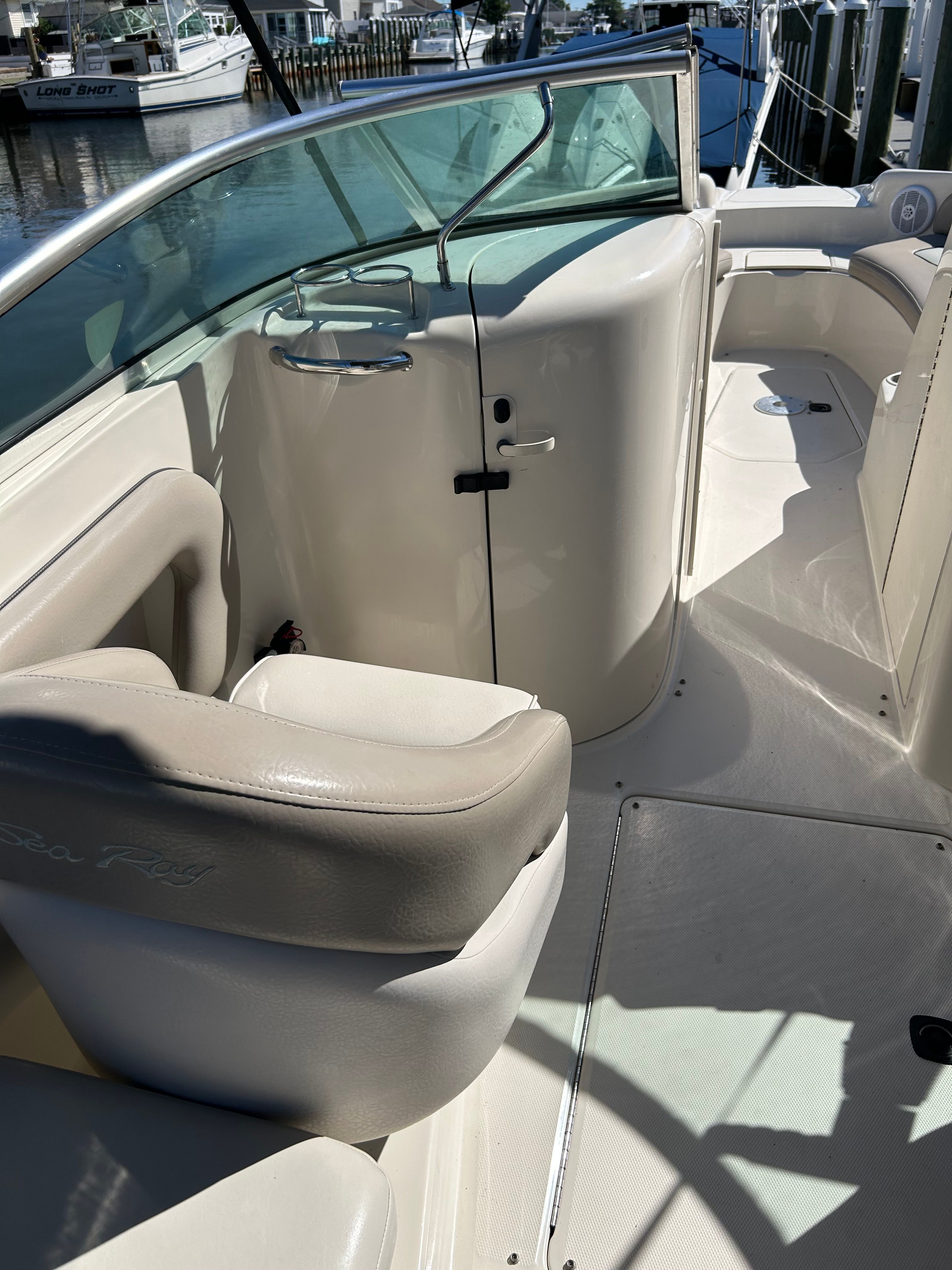 Interior of a 2003 Sea Ray 240 Sundeck boat at the dock.