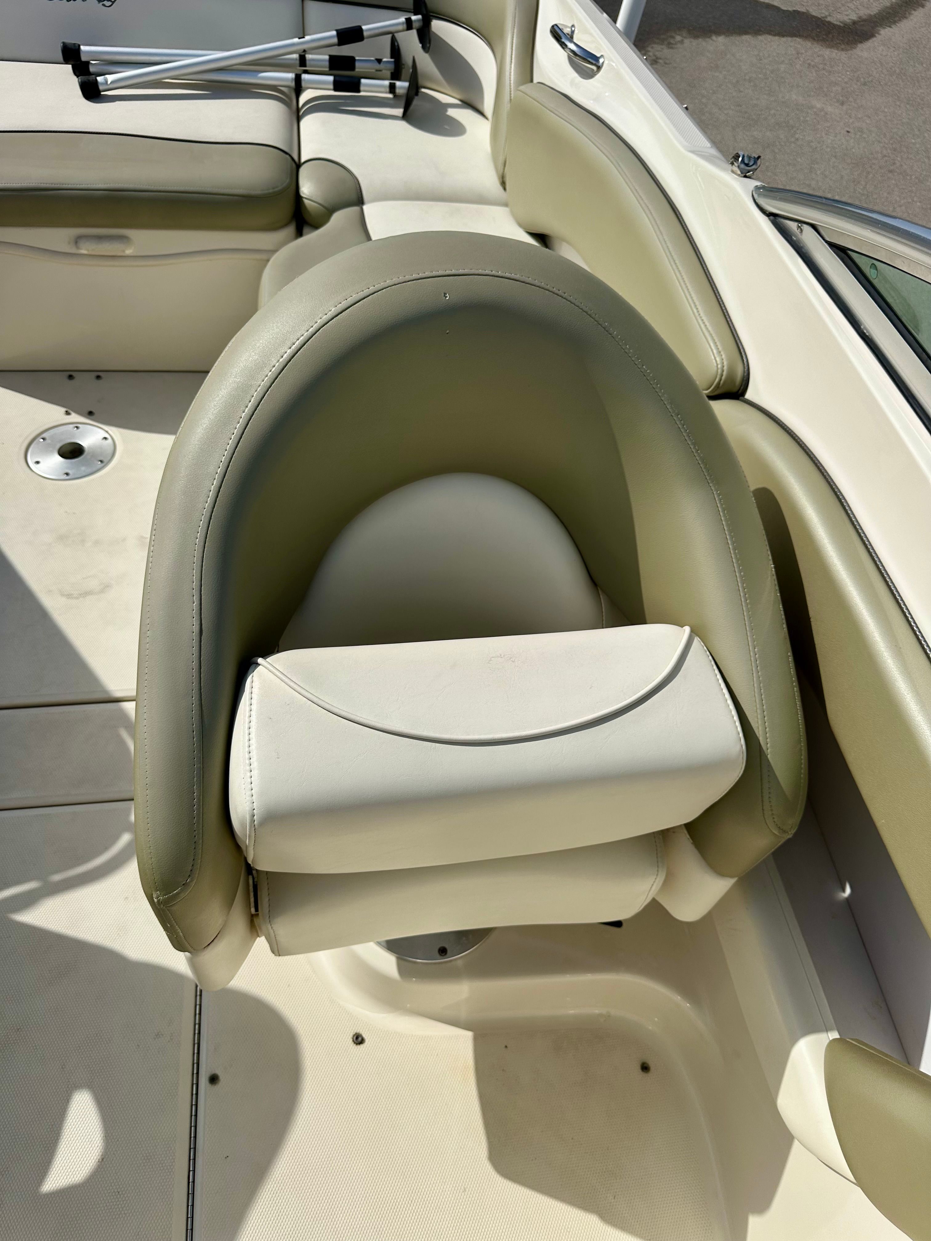 2006 Sea Ray 240 Sundeck seating area with beige upholstery.