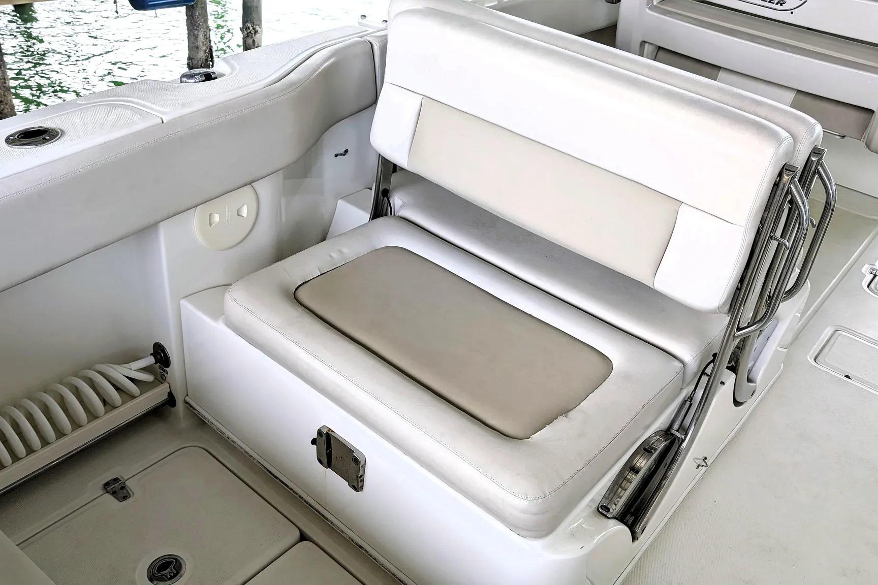 Interior seating of a 2017 Boston Whaler 320 Vantage boat, featuring white cushioned seats.
