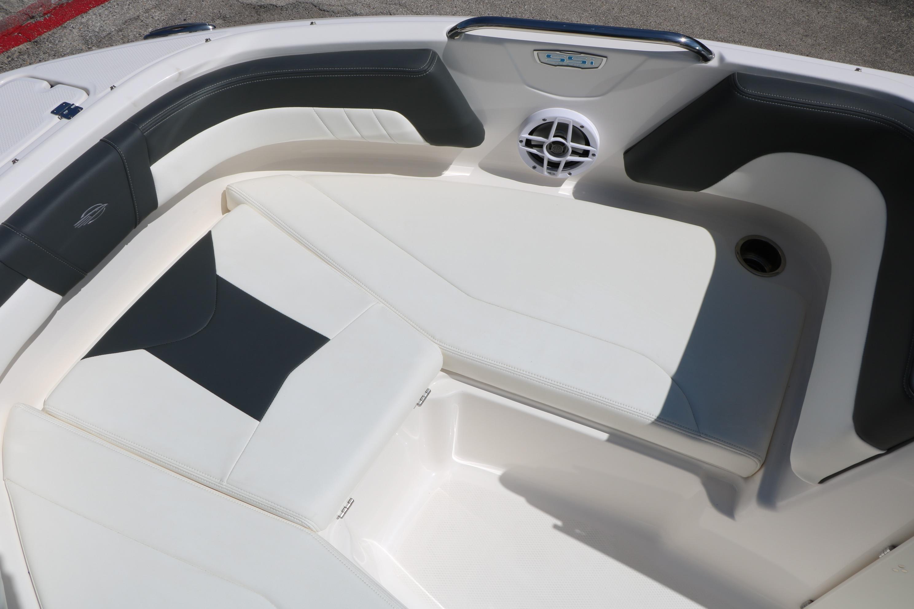 2025 Chaparral 21 SSi Ski & Fish boat interior with cushioned seating and speaker.