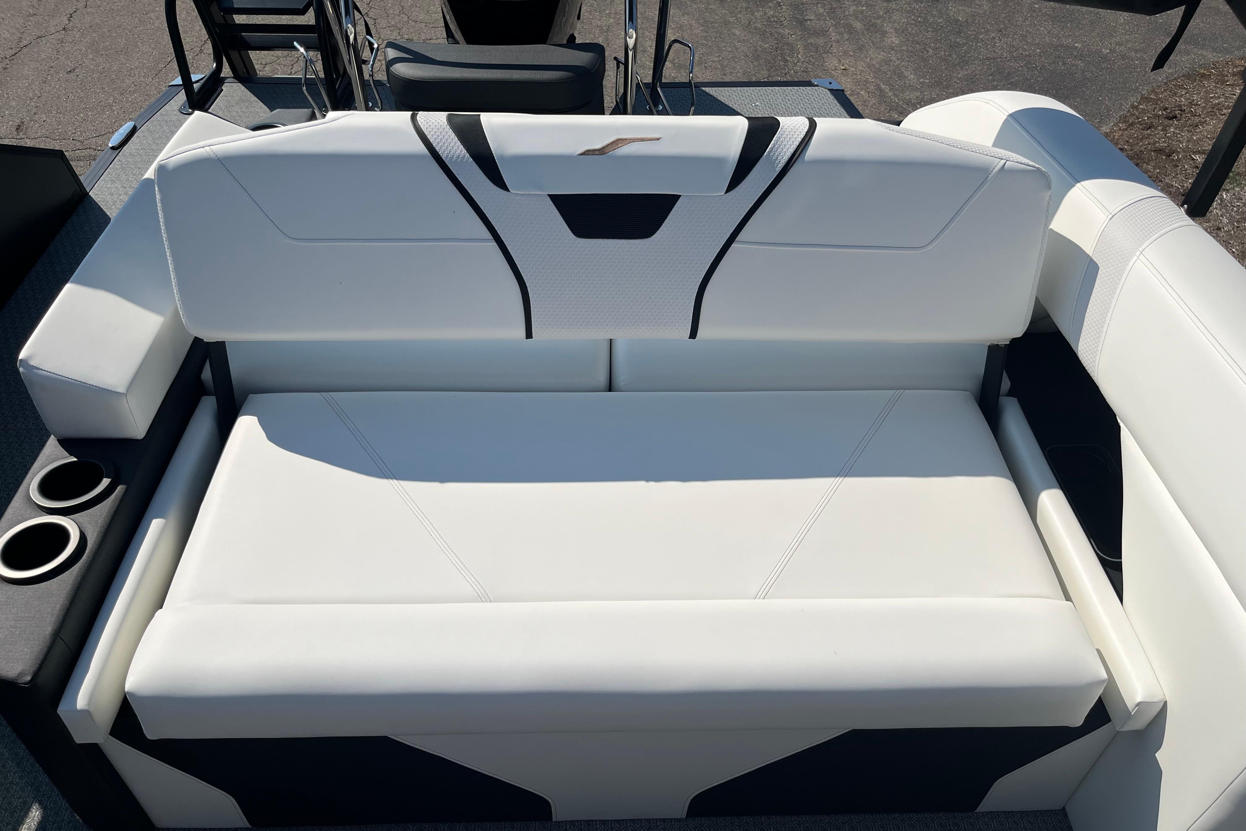 White leather seating on 2026 Evotti 725CS boat with cup holders.