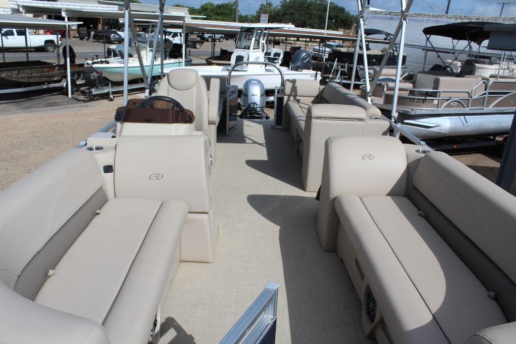 2021 Avalon VLS Quad Lounge 22 FT pontoon boat with spacious seating and modern design.