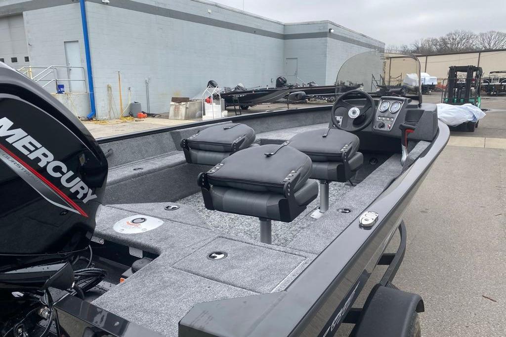 2026 Tracker Pro Guide V-16 SC boat with Mercury engine, featuring dual seats and control panel.