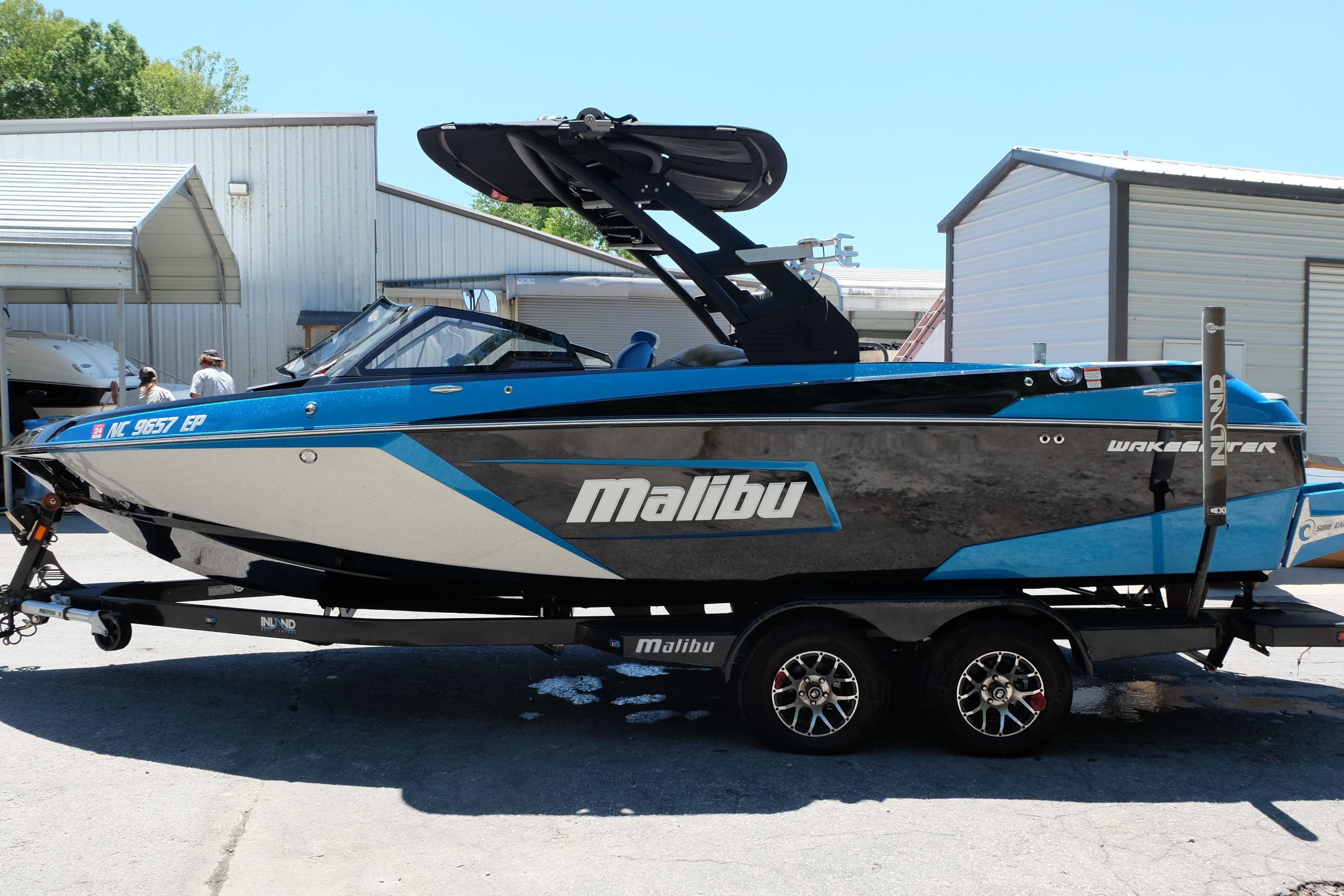 2020 Malibu Wakesetter 23 LSV boat on trailer, parked outdoors.