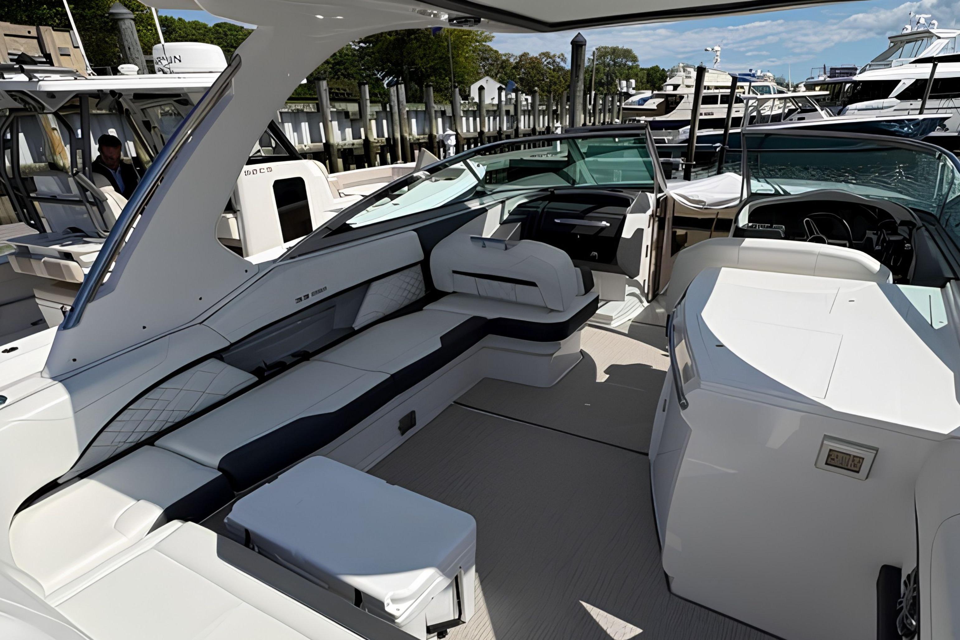 2020 Regal 33 OBX luxury boat interior with sleek seating and modern design at a marina.
