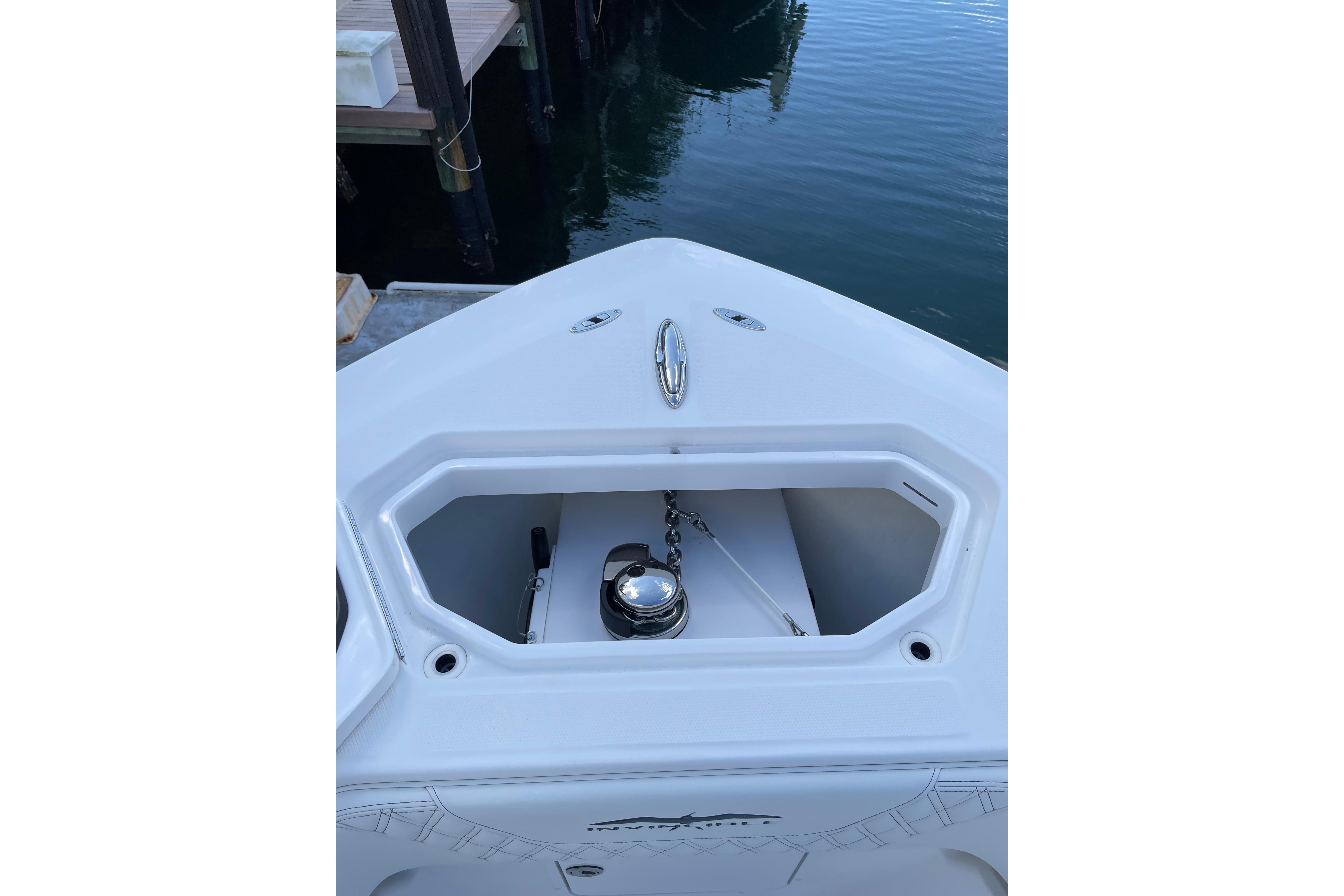 2024 Invincible 36 Open Fisherman boat anchor compartment at dockside.
