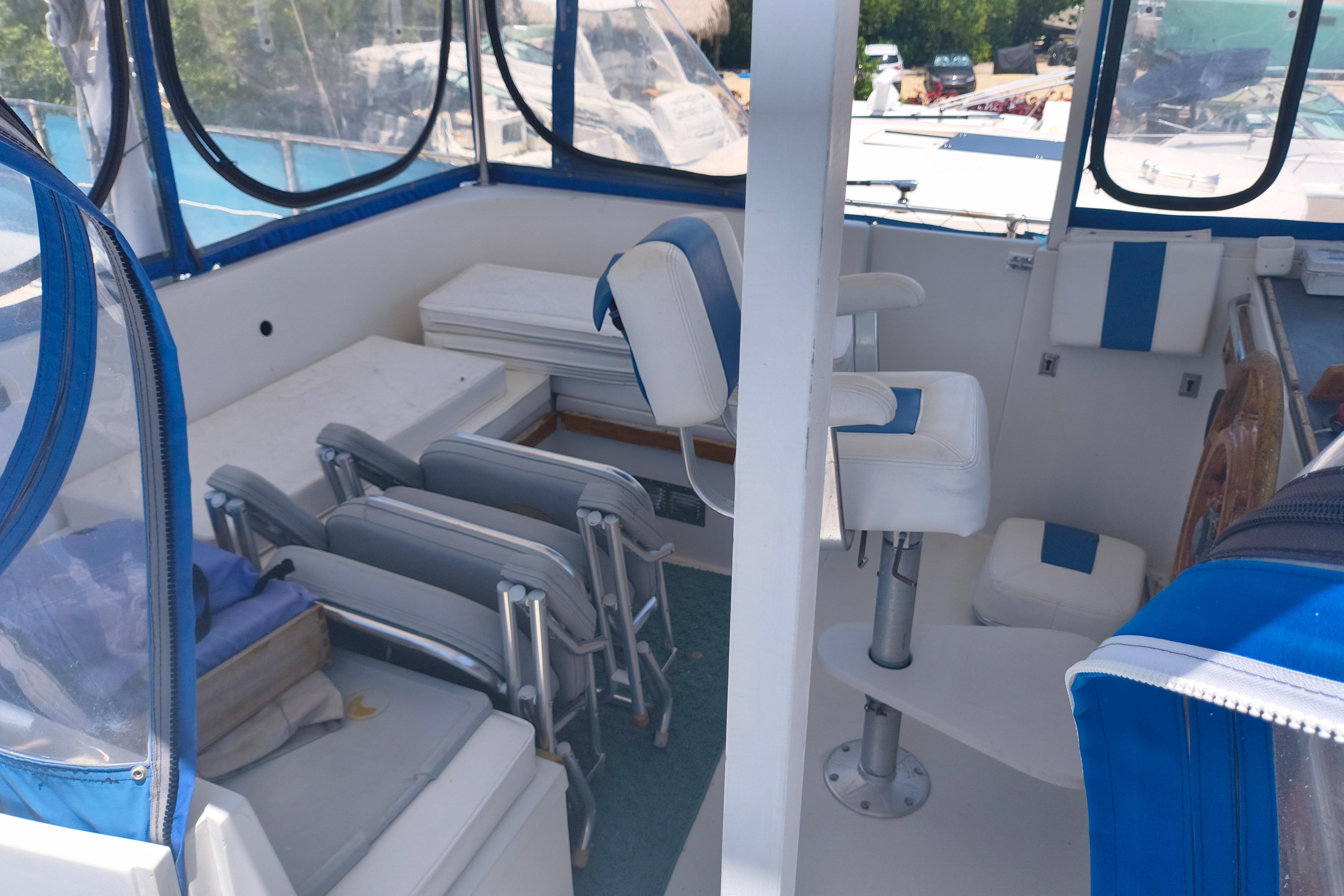 Interior of 1984 Kadey-Krogen Manatee boat with blue and white seating.